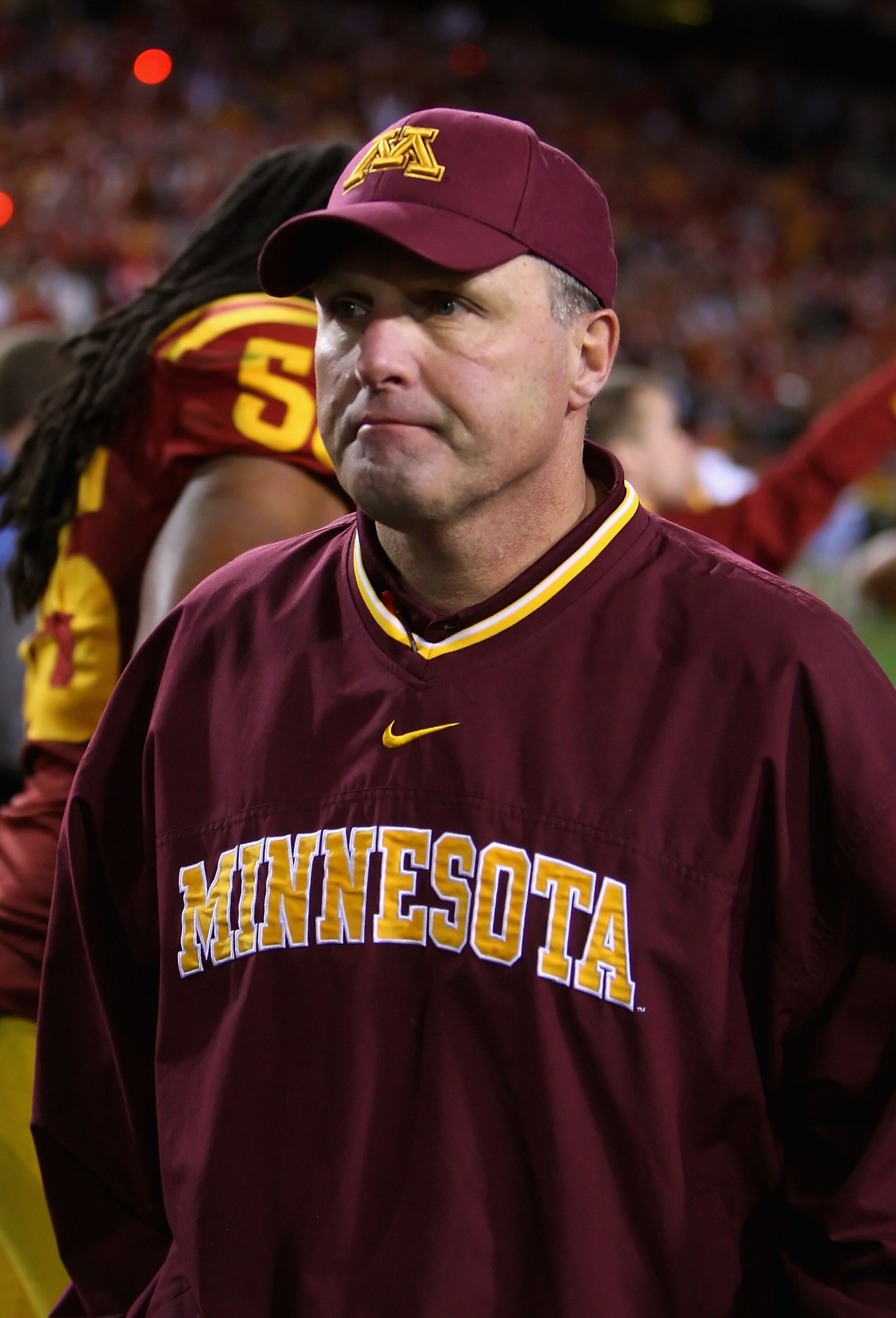 TEMPE, AZ - DECEMBER 31: Head coach Tim Brewster of the Minnesota Golden Gophers walks off the field after being defeated by the Iowa State Cyclones in the Insight Bowl at Arizona Stadium on December 31, 2009 in Tempe, Arizona. The Cyclones defeated the TEMPE, AZ - DECEMBER 31: Head coach Tim Brewster of the Minnesota Golden Gophers walks off the field after being defeated by the Iowa State Cyclones in the Insight Bowl at Arizona Stadium on December 31, 2009 in Tempe, Arizona. The Cyclones defeated the
