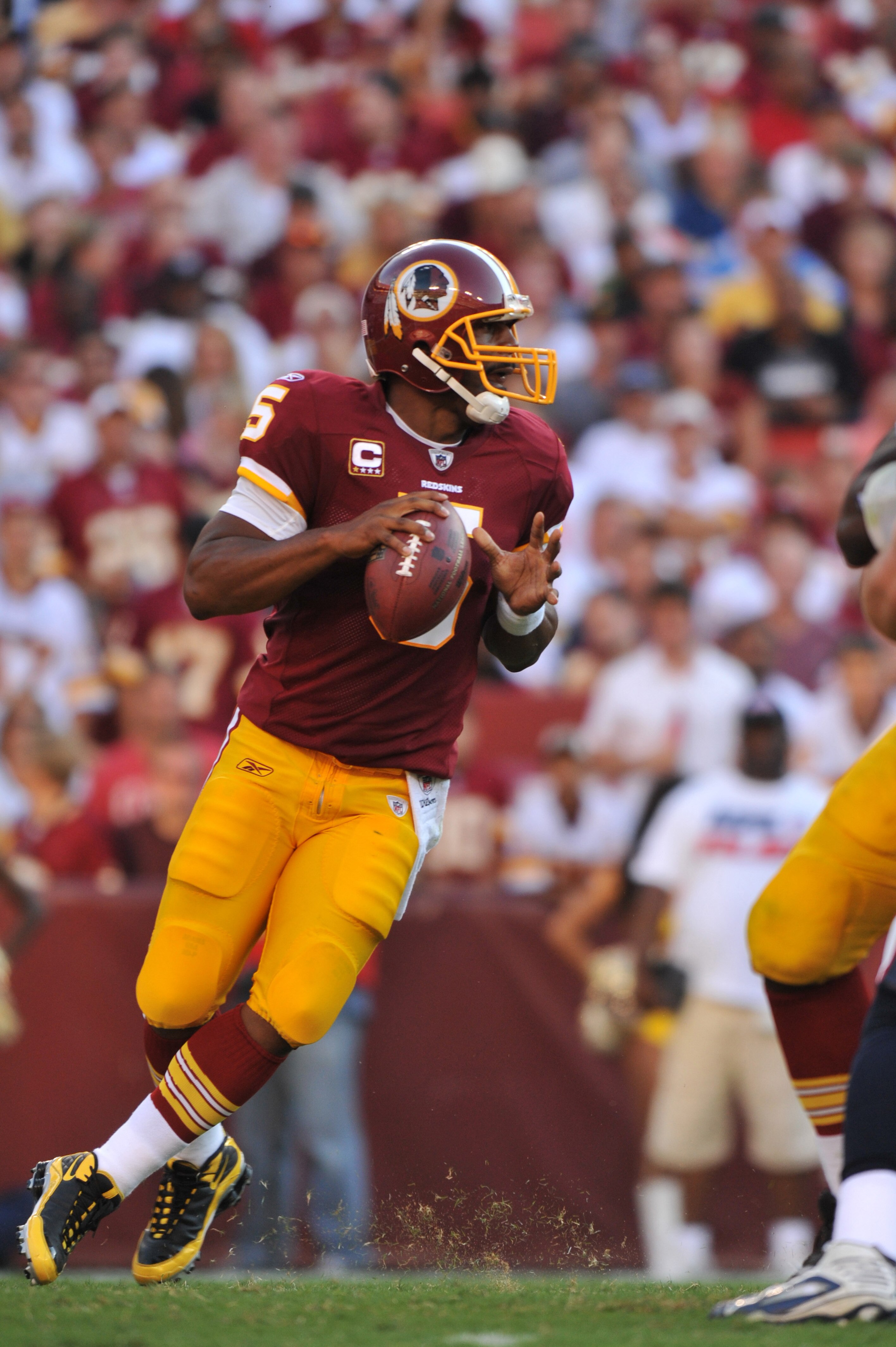 LANDOVER - SEPTEMBER 19:  Donovan McNabb #5 of the Washington Redskins passes during the game against the Houston Texans at FedExField on September 19, 2010 in Landover, Maryland. The Texans defeated the Redskins in overtime 30-27. (Photo by Larry French/