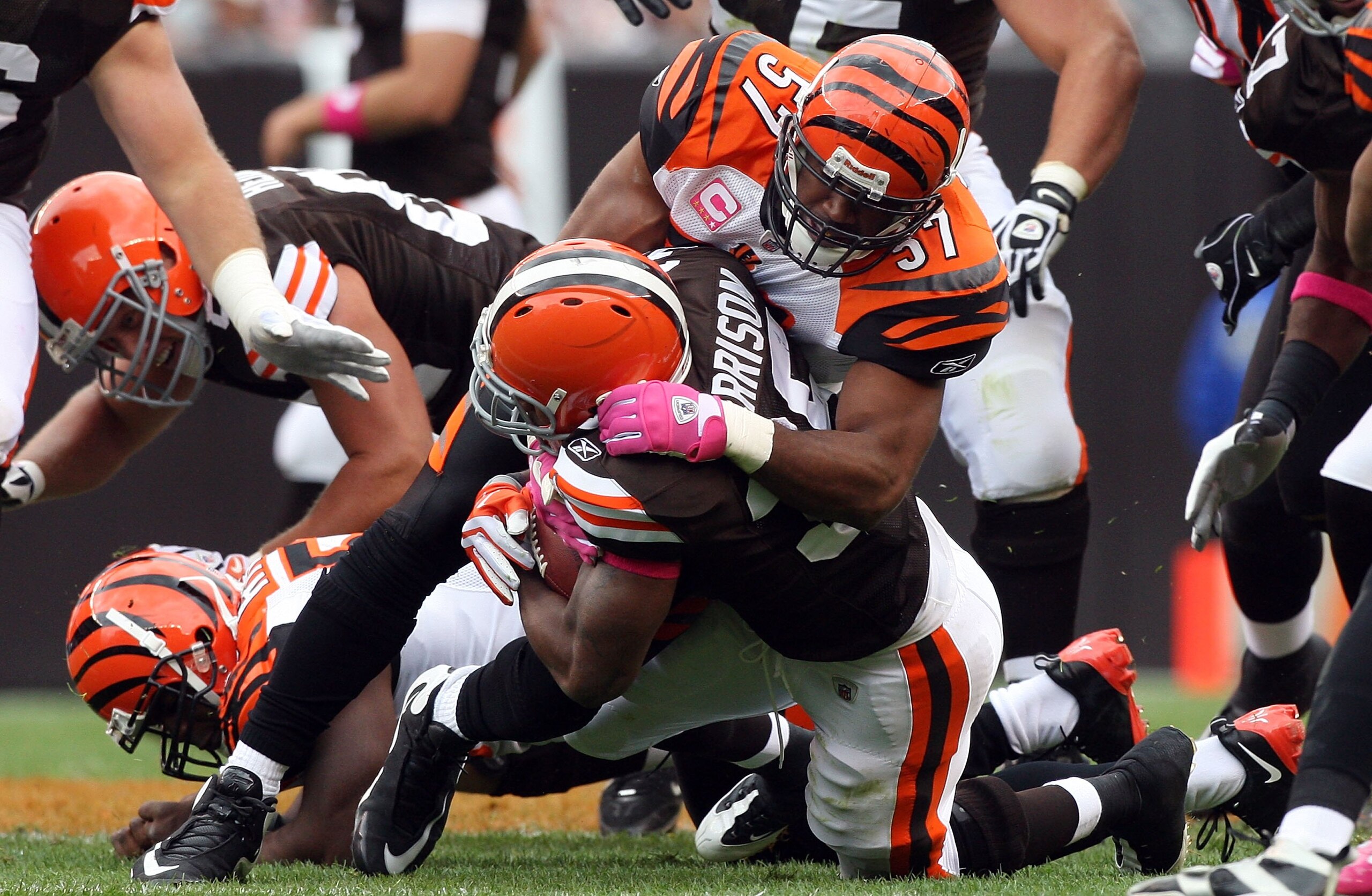 CLEVELAND - OCTOBER 04:  Dhani Jones #57 of the Cincinnati Bengals makes a tackle against the Cleveland Browns during their game at Cleveland Browns Stadium on October 4, 2009 in Cleveland, Ohio. The Bengals defeated the Browns 23-20 in overtime.  (Photo