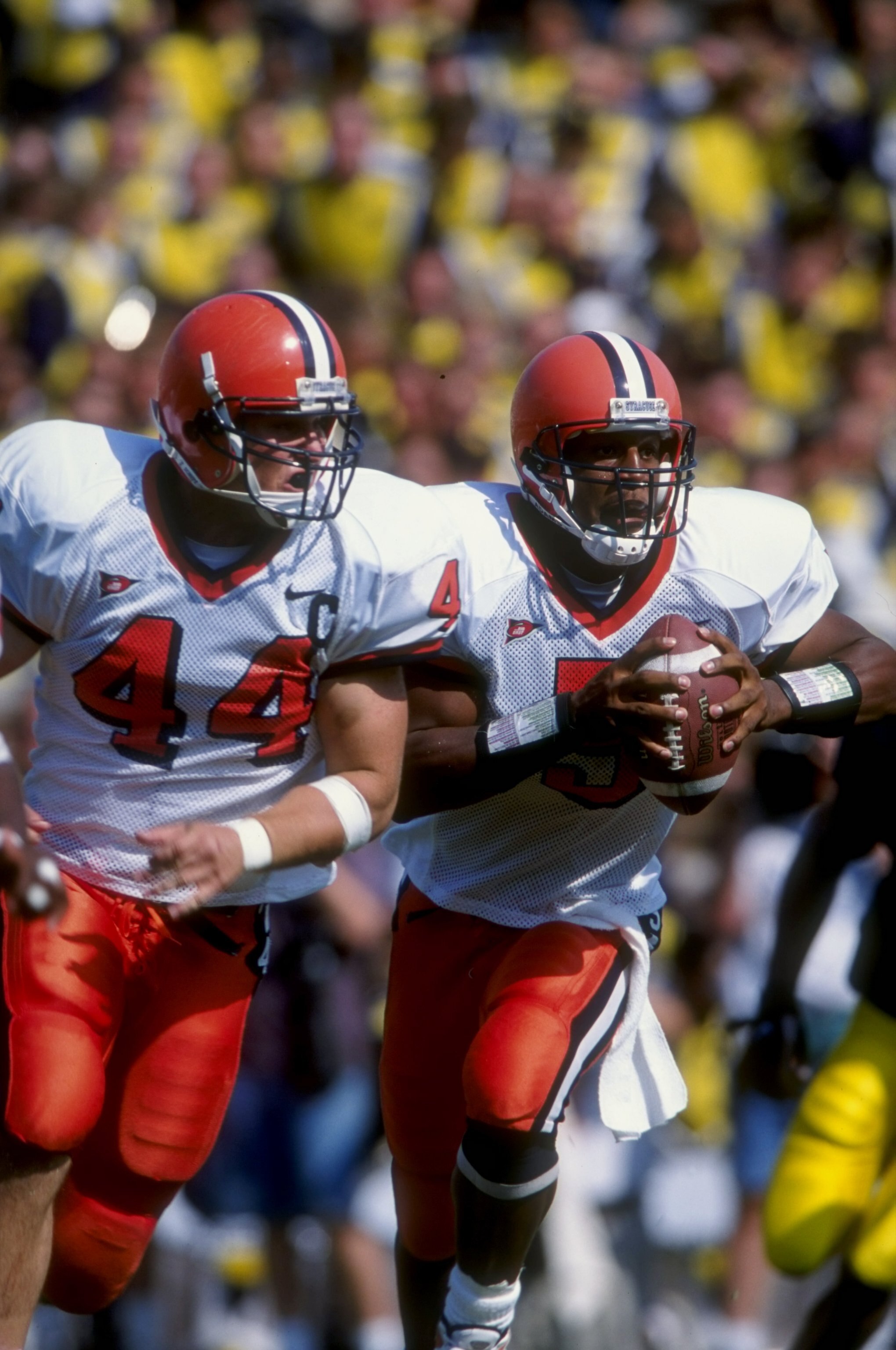 12 Sep 1998:  Quarterback Donovan McNabb #5 and fullback Rob Konrad #44 of the Syracuse Orangemen in action during a game against the Michigan Wolverines at the Michigan Stadium in Ann Arbor, Michigan. The Orangemen defeated the Wolverines 38-28. Mandator