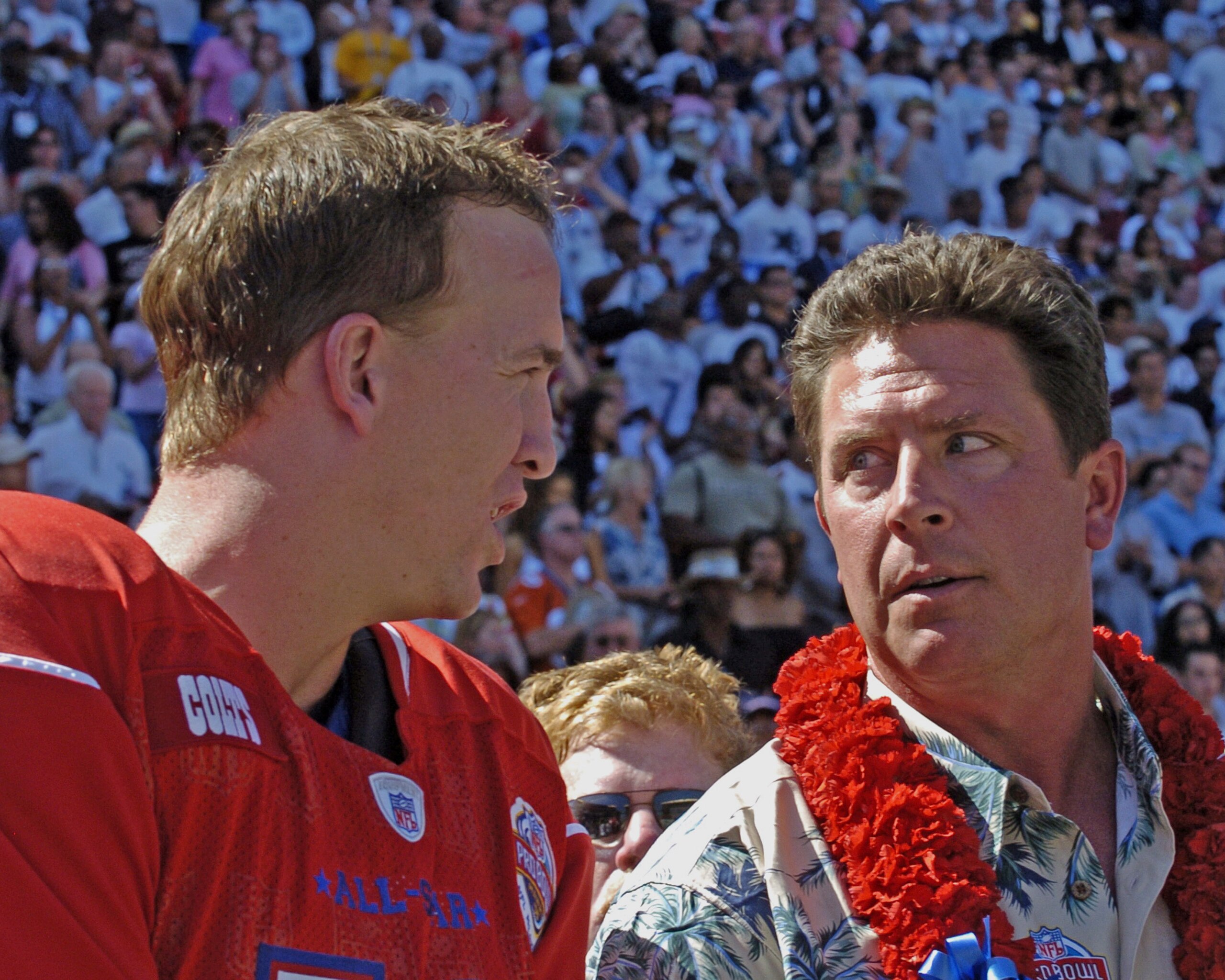 Indianapolis Colts quarterback Peyton Manning talks with Hall of Fame inductee Dan Marino before   the 2005 Pro Bowl game at Aloha Stadium, Honolulu February 13, 2005.  (Photo by Al Messerschmidt/Getty Images)