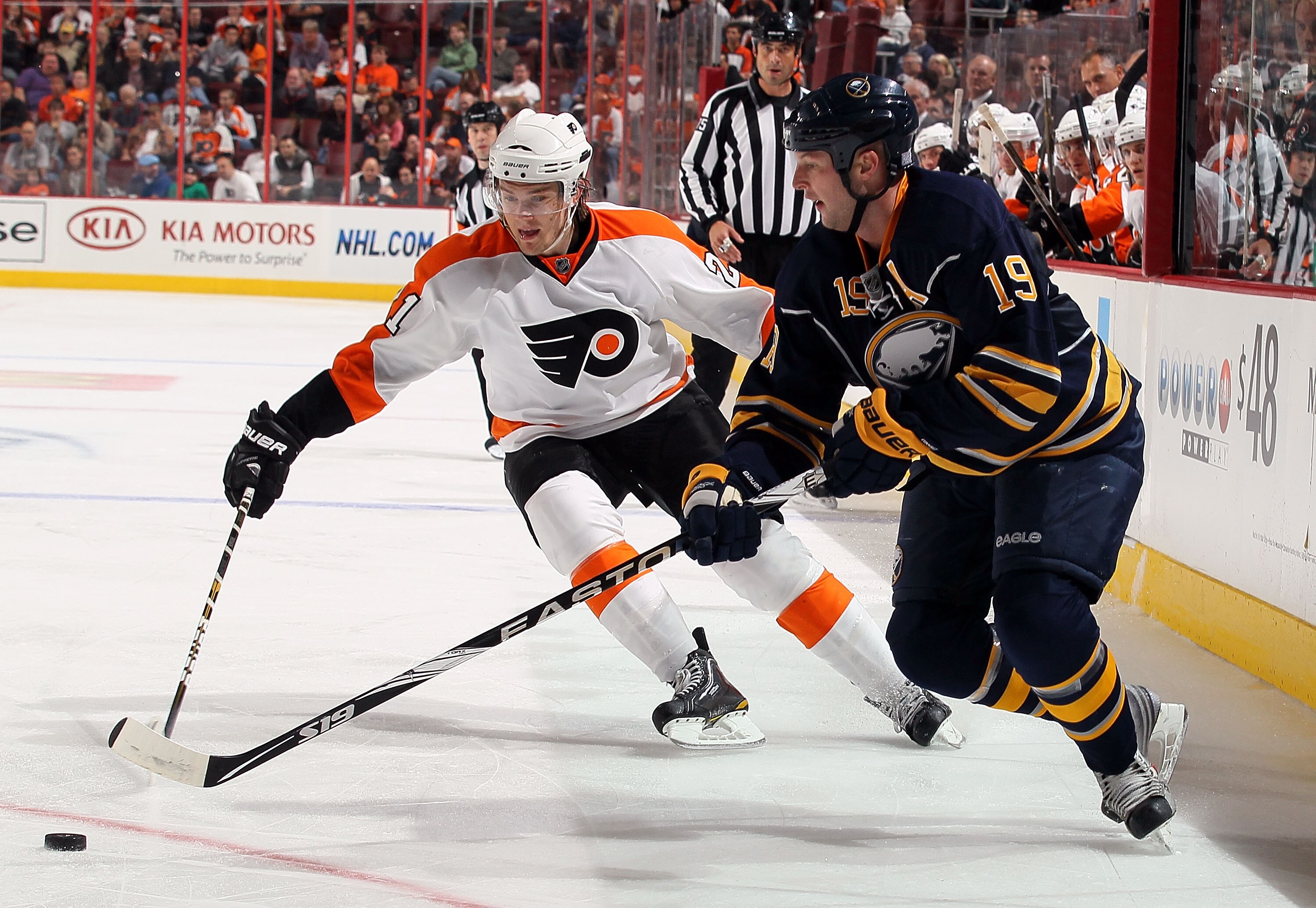 PHILADELPHIA - OCTOBER 01:  Tim Connolly #19 of the Buffalo Sabres controls the puck against James van Riemsdyk #21 of the Philadelphia Flyers on October 1, 2010 at Wells Fargo Center in Philadelphia, Pennsylvania. The Flyers defeated the Sabres 3-1.  (Ph