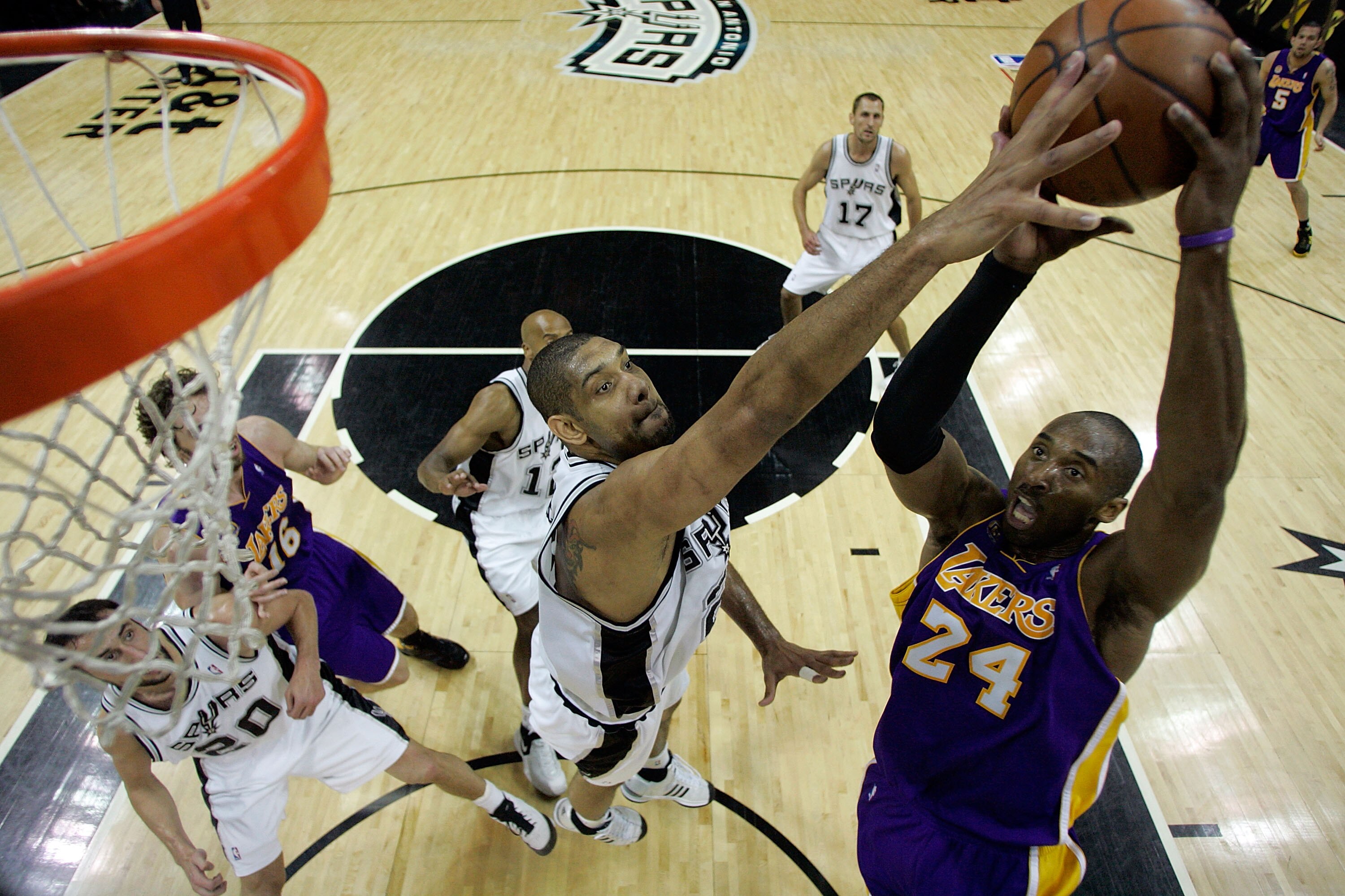 SAN ANTONIO - MAY 27:  Tim Duncan #21 of the San Antonio Spurs goes to block the shot of Kobe Bryant #24 of the Los Angeles Lakers in Game Four of the Western Conference Finals during the 2008 NBA Playoffs on May 27, 2008 at the AT&T Center in San Antonio