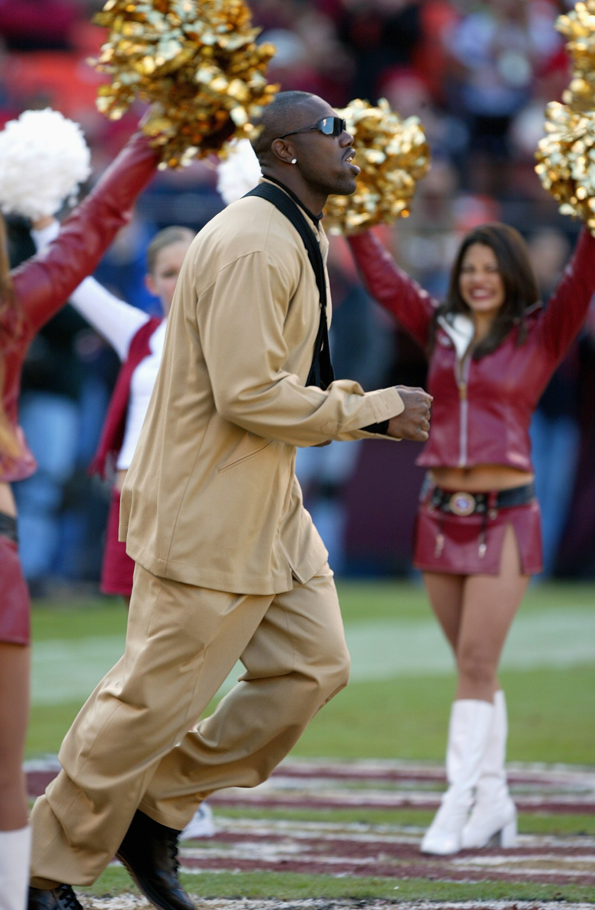 SAN FRANCISCO - DECEMBER 27:  Wide receiver Terrell Owens #81 of the San Francisco 49ers, out with a broken collarbone, runs on the field before the game against Seattle Seahawks on December 27, 2003 at Candelstick Park in San Francisco, California. The S