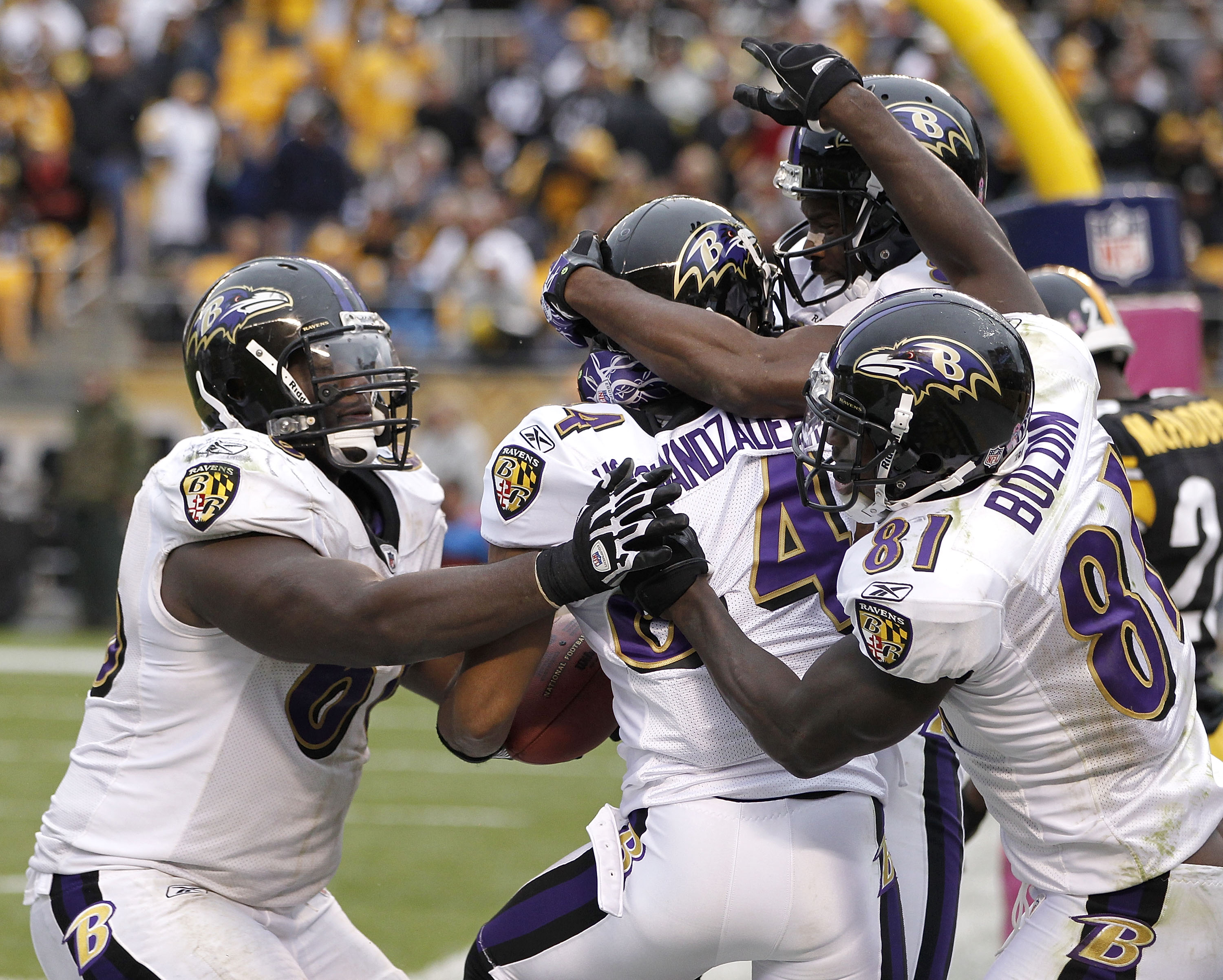 PITTSBURGH - OCTOBER 03:  T.J. Houshmandzadeh #84 of the Baltimore Ravens celebrates his game winning touchdown with teammates while playing the Pittsburgh Steelers on October 3, 2010 at Heinz Field in Pittsburgh, Pennsylvania.  (Photo by Gregory Shamus/G