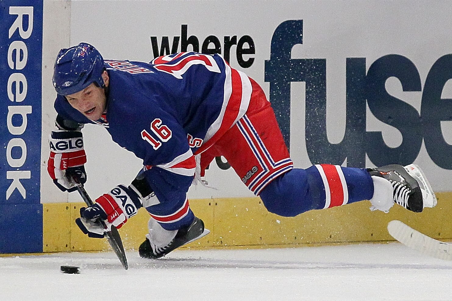 NEW YORK - OCTOBER 01: Sean Avery #16 of the New York Rangers tries to control the puck against the Ottawa Senators during their preseason game on October 1, 2010 at Madison Square Garden in New York City.  (Photo by Chris McGrath/Getty Images)