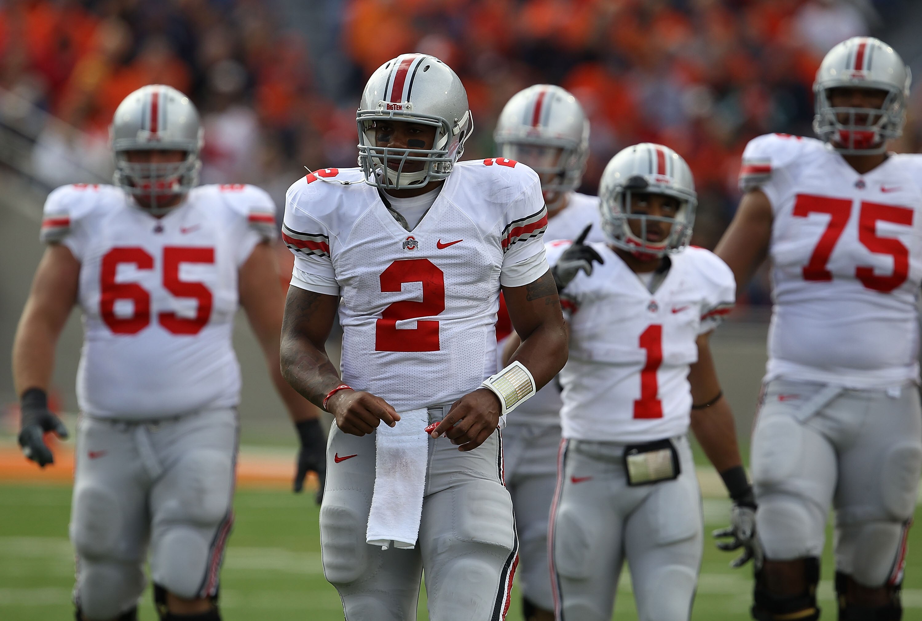 CHAMPAIGN, IL - OCTOBER 02: Terrelle Pryor #2 of the Ohio State Buckeyes leads teammates including Justin Boren #65, Dan Herron #1 and Mike Adams #75 off the field during a game against the Illinois Fighting Illini at Memorial Stadium on October 2, 2010 i CHAMPAIGN, IL - OCTOBER 02: Terrelle Pryor #2 of the Ohio State Buckeyes leads teammates including Justin Boren #65, Dan Herron #1 and Mike Adams #75 off the field during a game against the Illinois Fighting Illini at Memorial Stadium on October 2, 2010 i