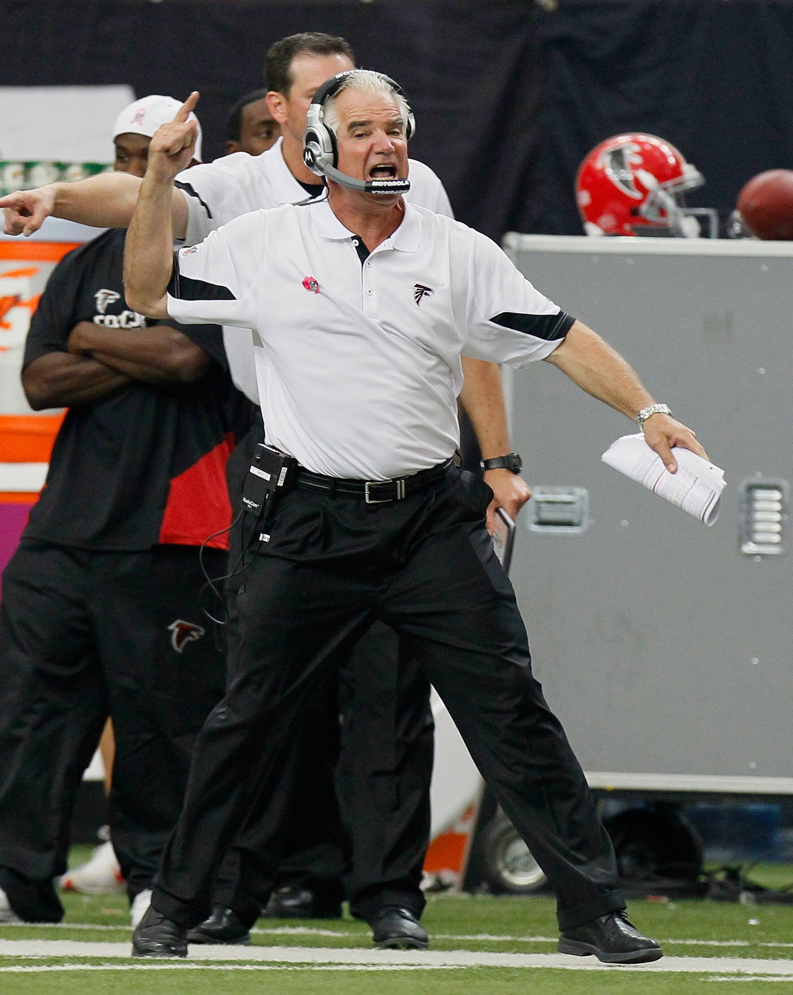 ATLANTA - OCTOBER 03:  Head coach Mike Smith of the Atlanta Falcons questions a flag thrown during a drive by the San Francisco 49ers at Georgia Dome on October 3, 2010 in Atlanta, Georgia.  (Photo by Kevin C. Cox/Getty Images)