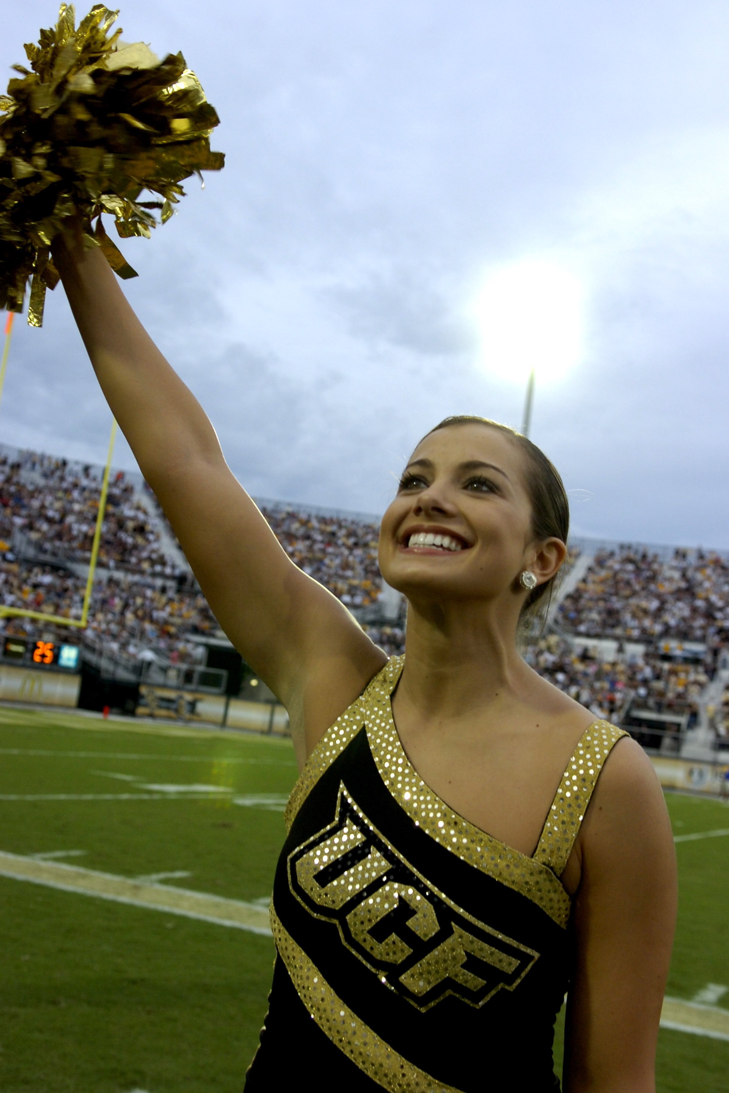 ORLANDO, FL - OCTOBER 20: A cheerleader of the University of Central Florida Golden Knights entertains against the Tulsa Golden Hurricane at Bright House Stadium on October 20, 2007 in Orlando, Florida.  UCF won 44 - 23. (Photo by Al Messerschmidt/Getty I