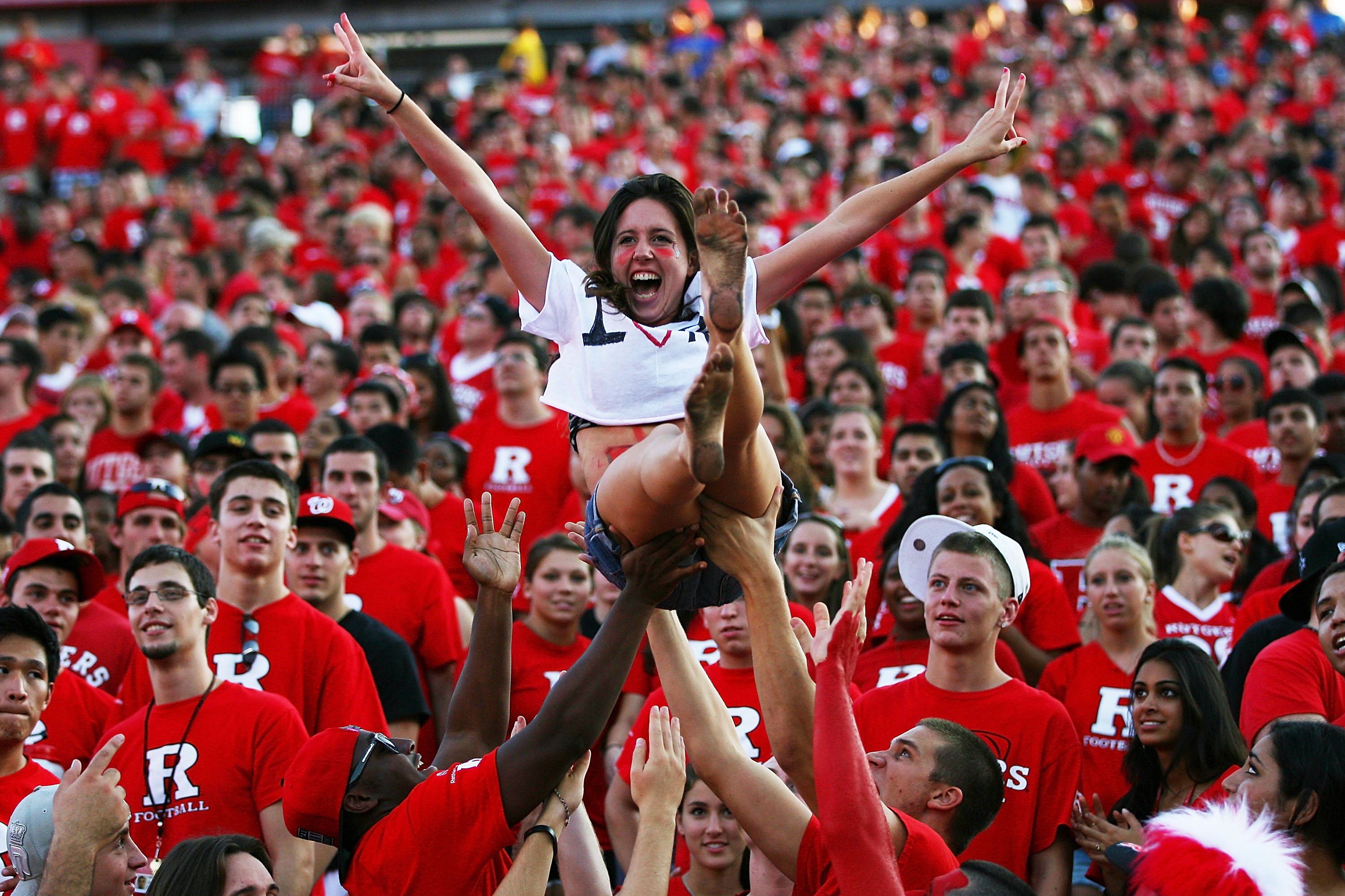 NEW BRUNSWICK, NJ - SEPTEMBER 25:  Jami O'Leary, a sophomore at Rutgers, is thrown into the air by fans during a Rutgers Scarlet Knights game against the North Carolina Tar Heels at Rutgers Stadium on September 25, 2010 in New Brunswick, New Jersey.  (Pho