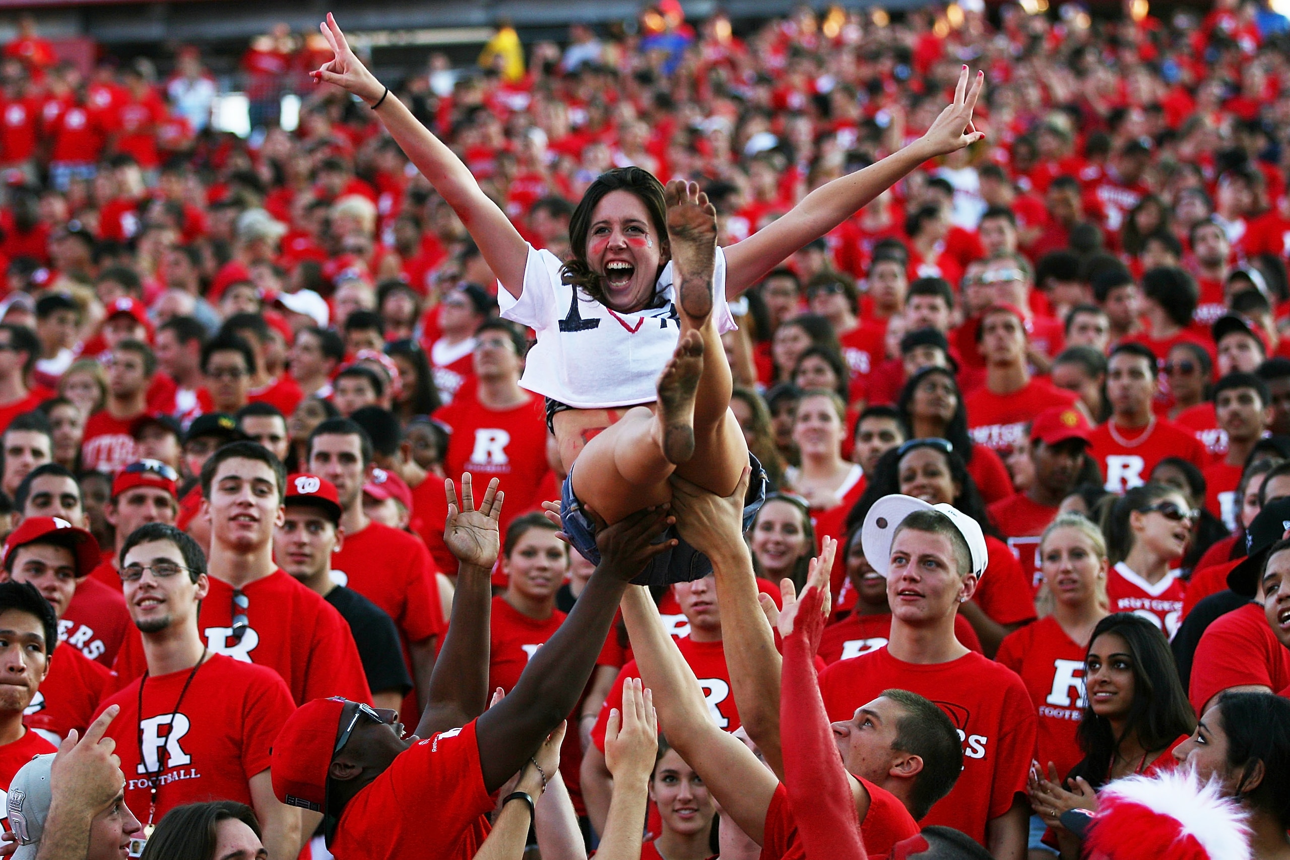 NEW BRUNSWICK, NJ - SEPTEMBER 25:  Jami O'Leary, a sophomore at Rutgers, is thrown into the air by fans during a Rutgers Scarlet Knights game against the North Carolina Tar Heels at Rutgers Stadium on September 25, 2010 in New Brunswick, New Jersey.  (Pho