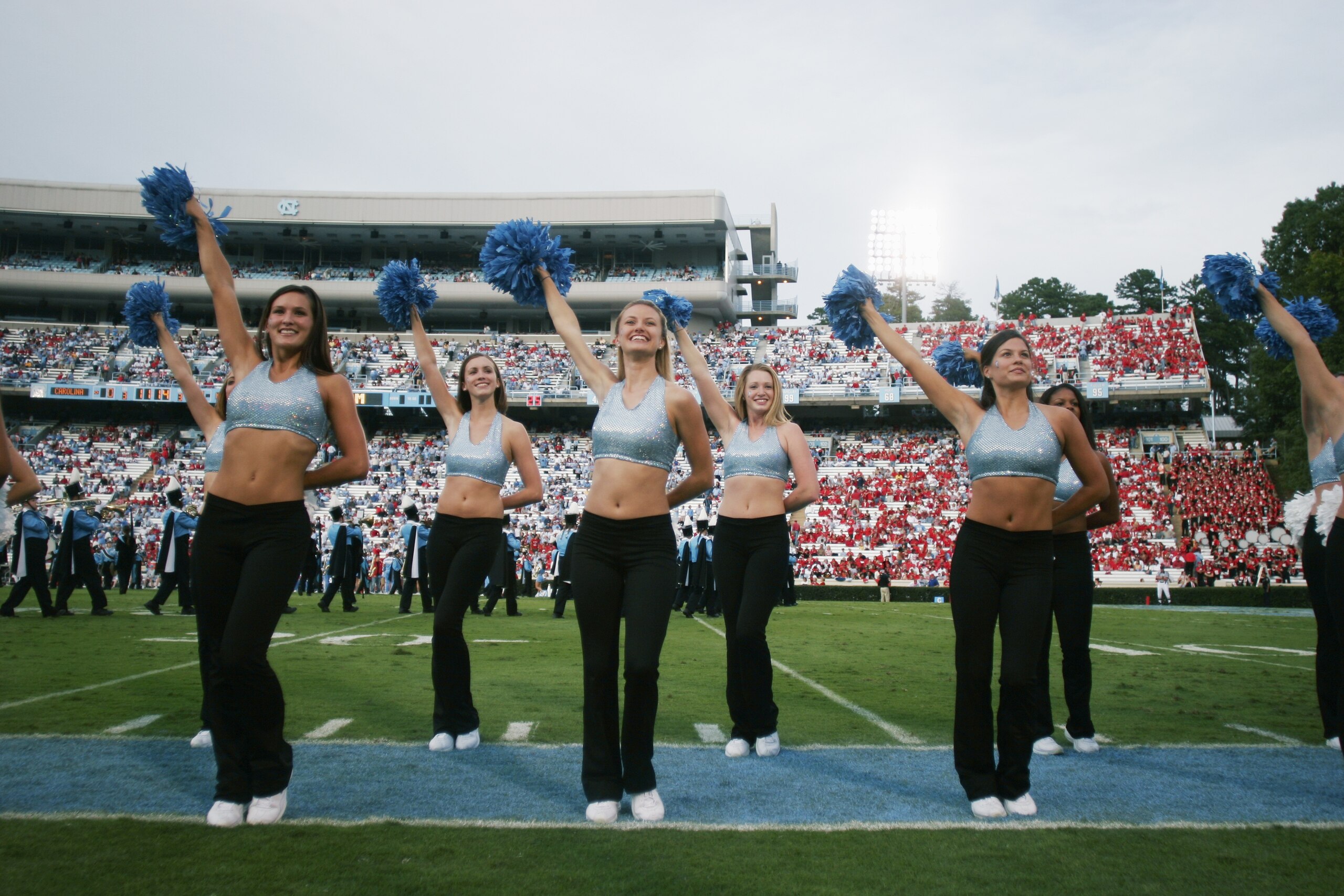 CHAPEL HILL, NC - OCTOBER 9:  North Carolina Tar Heels cheerleaders perform during the game against the North Carolina State Wolfpack on October 9, 2004 at Kenan Stadium Stadium in Chapel Hill, North Carolina. North Carolina defeated North Carolina State