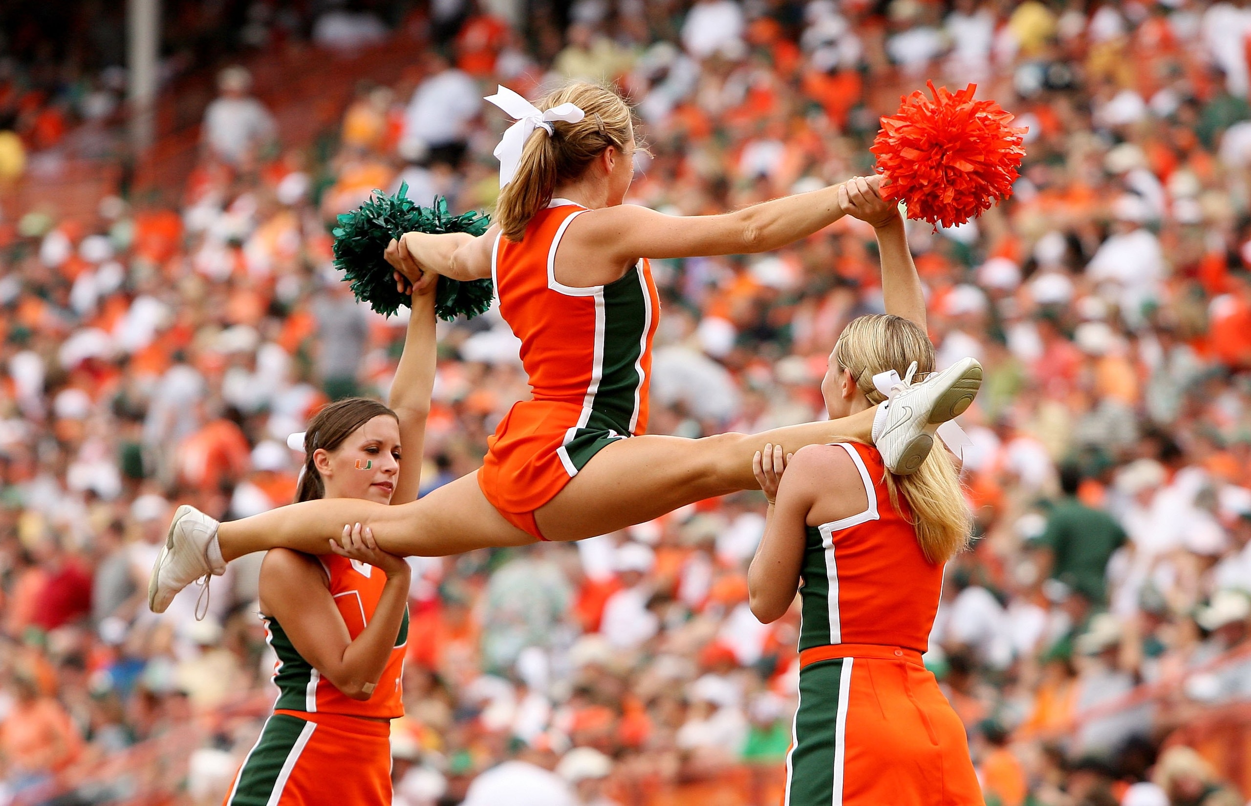 CORAL GABLES, FL - OCTOBER 13:  The Miami cheerleaders perform as the Miami Hurricanes take on the Georgia Tech Yellow Jacketsat the Orange Bowl on October 13, 2007 in Coral Gables, Florida. Georgia Tech defeated Miami 17-14.  (Photo by Doug Benc/Getty Im