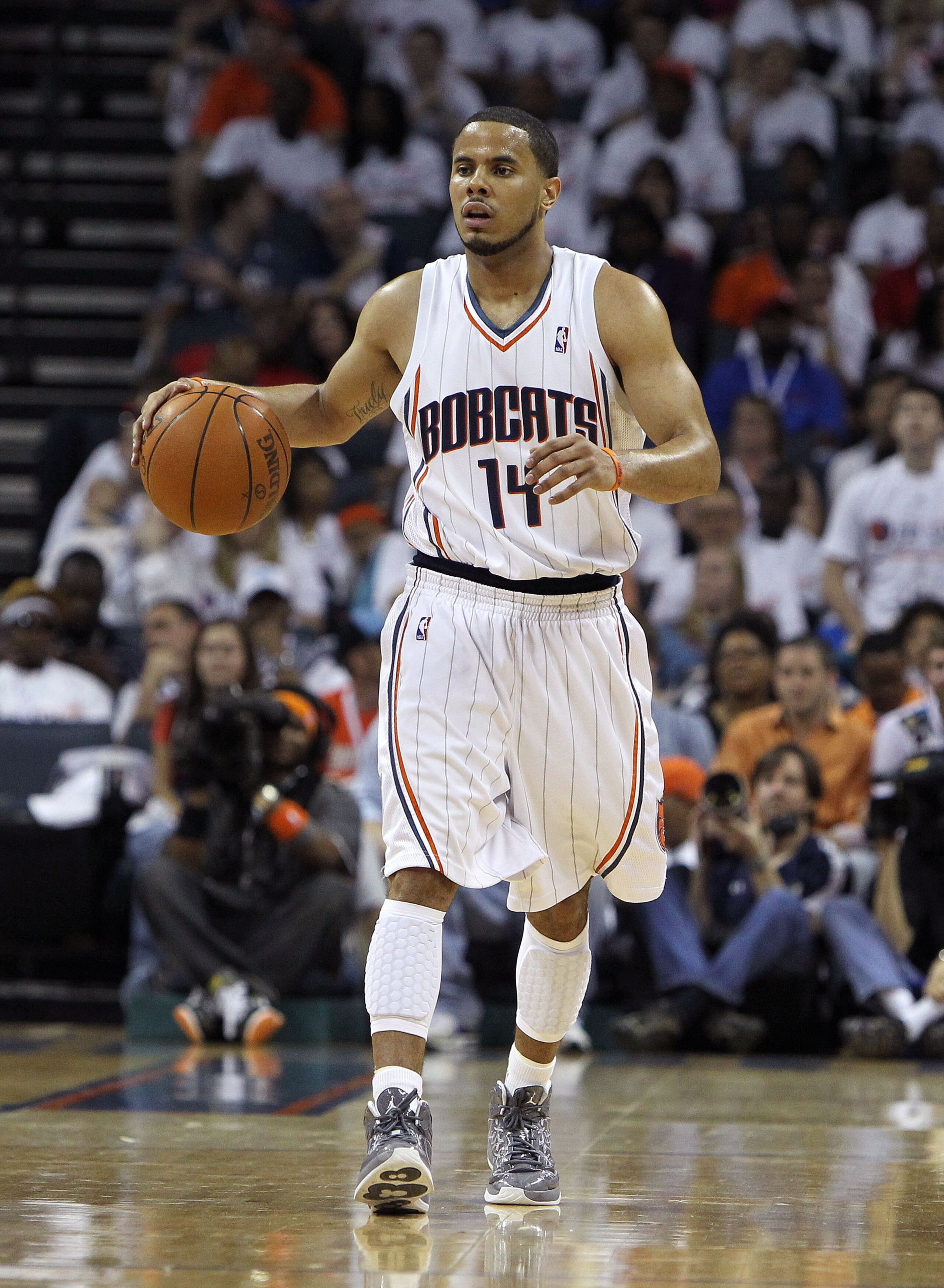 CHARLOTTE - APRIL 24: Guard D.J. Augustin #14 of the Charlotte Bobcats dribbles the ball upcourt during Game Three of the Eastern Conference Quarterfinals against the Orlando Magic during the 2010 NBA Playoffs at Time Warner Cable Arena on April 24, 2010 CHARLOTTE - APRIL 24: Guard D.J. Augustin #14 of the Charlotte Bobcats dribbles the ball upcourt during Game Three of the Eastern Conference Quarterfinals against the Orlando Magic during the 2010 NBA Playoffs at Time Warner Cable Arena on April 24, 2010
