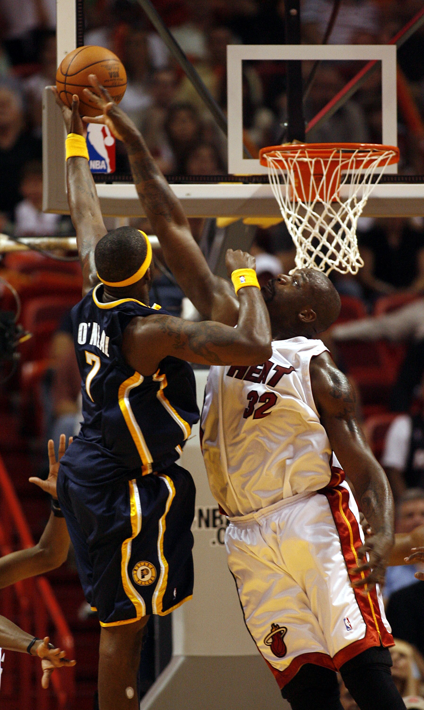 MIAMI - APRIL 13: Jermaine O'Neal #7 of the Indiana Pacers is blocked by Shaquille O'Neal #32 of the Miami Heat on April 13, 2007 at the American Airlines Arena in Miami  Florida. NOTE TO USER: User expressly acknowledges and agrees that, by downloading a