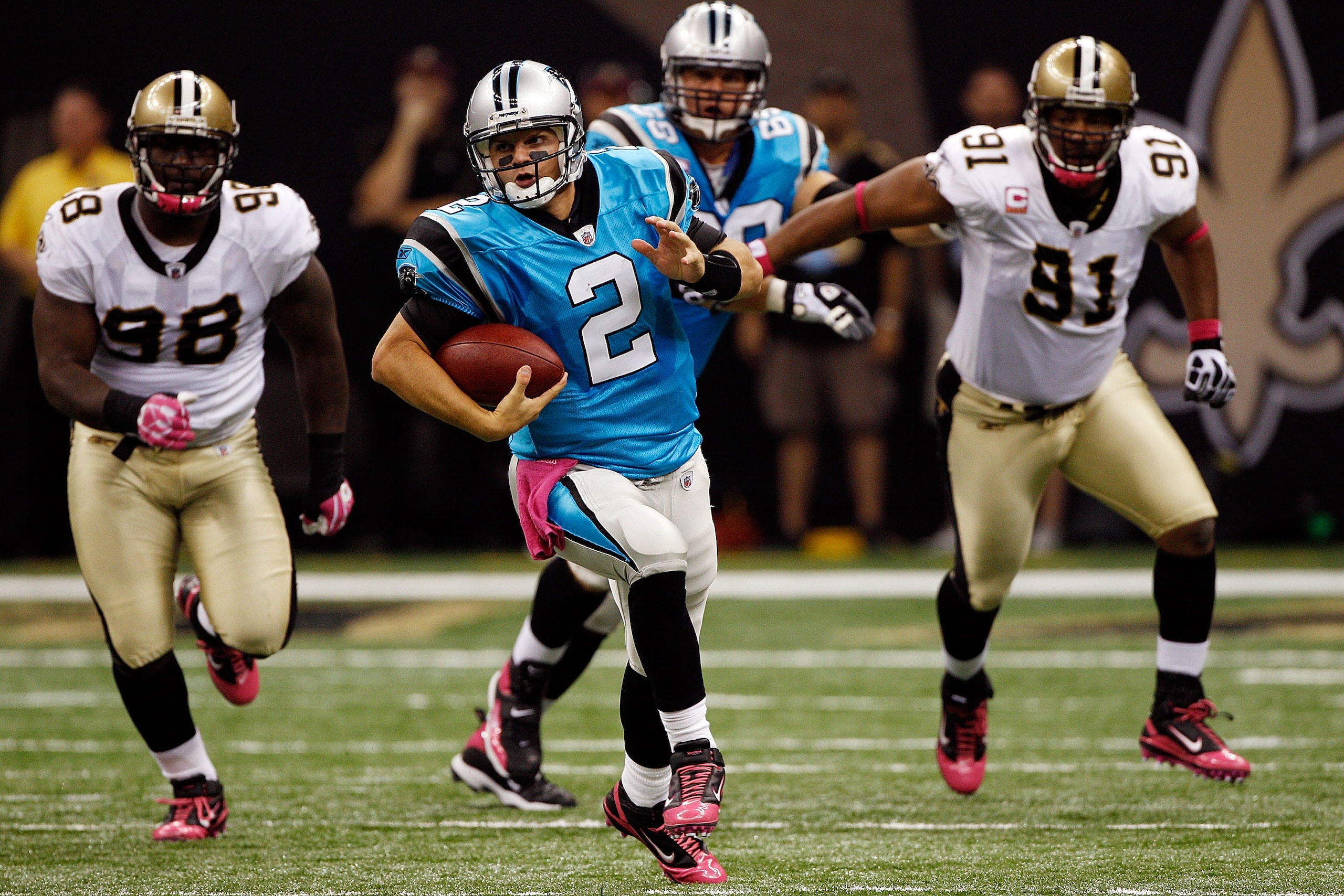 NEW ORLEANS - OCTOBER 03:  Jimmy Clausen #2 of the Carolina Panthers runs with the ball against the New Orleans Saints at the Louisiana Superdome on October 3, 2010 in New Orleans, Louisiana.   The Saints defeated the Panthers 16-14.  (Photo by Chris Gray