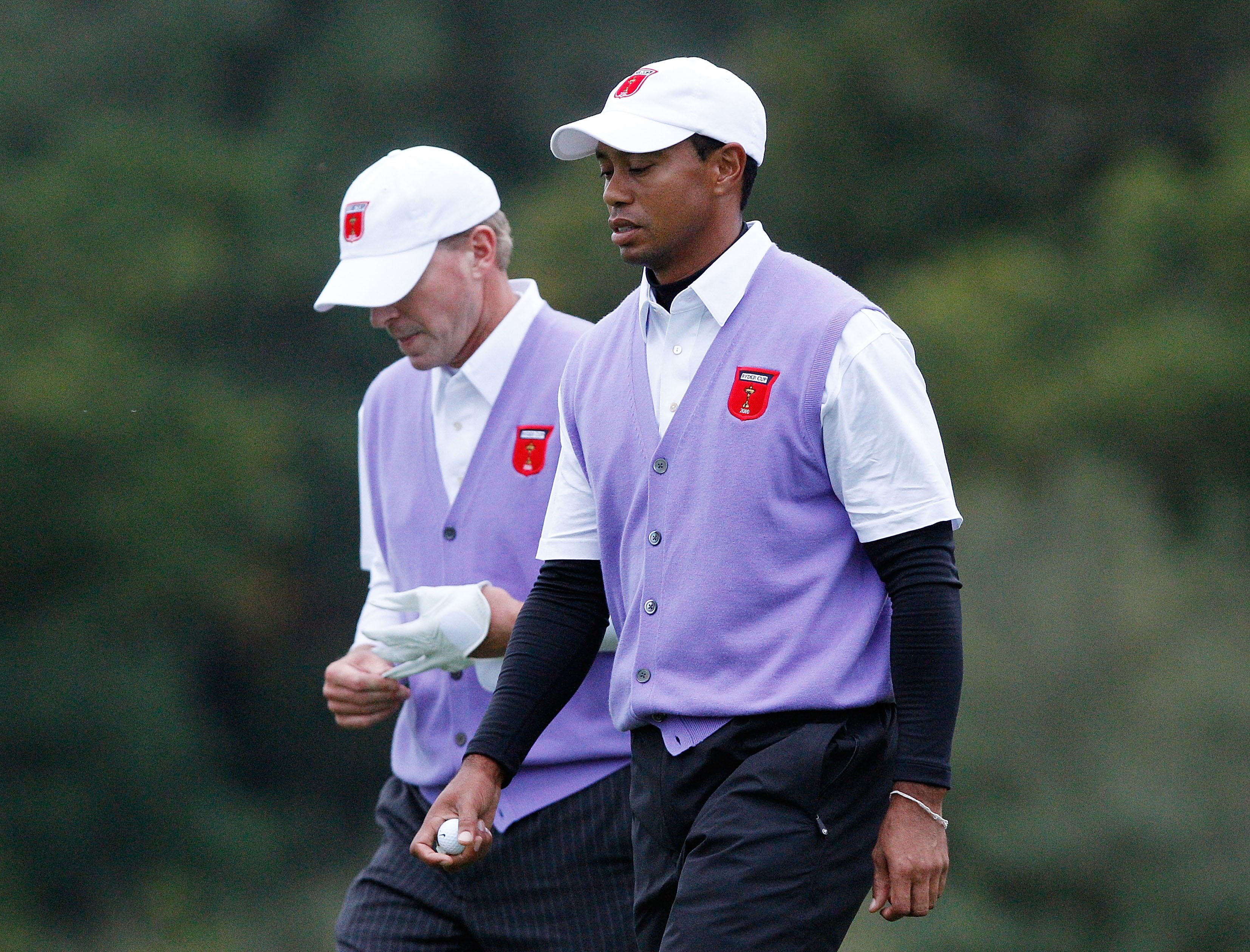 NEWPORT, WALES - OCTOBER 02:  Tiger Woods (R) and Steve Stricker of the USA walk to a green during the Fourball & Foursome Matches during the 2010 Ryder Cup at the Celtic Manor Resort on October 2, 2010 in Newport, Wales.  (Photo by Sam Greenwood/Getty Im