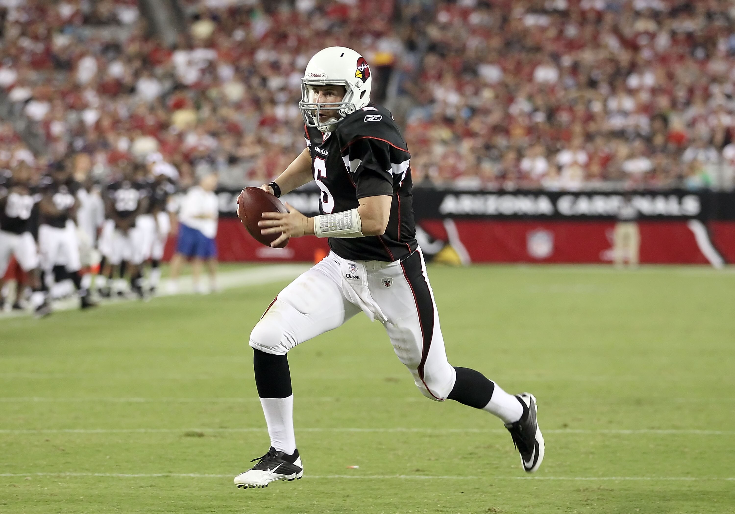 GLENDALE, AZ - SEPTEMBER 02:  Quarterback Max Hall #6 of the Arizona Cardinals scrambles for a 6 yard touchdown against the Washington Redskins during the third quarter of the preseason NFL game at the University of Phoenix Stadium on September 2, 2010 in