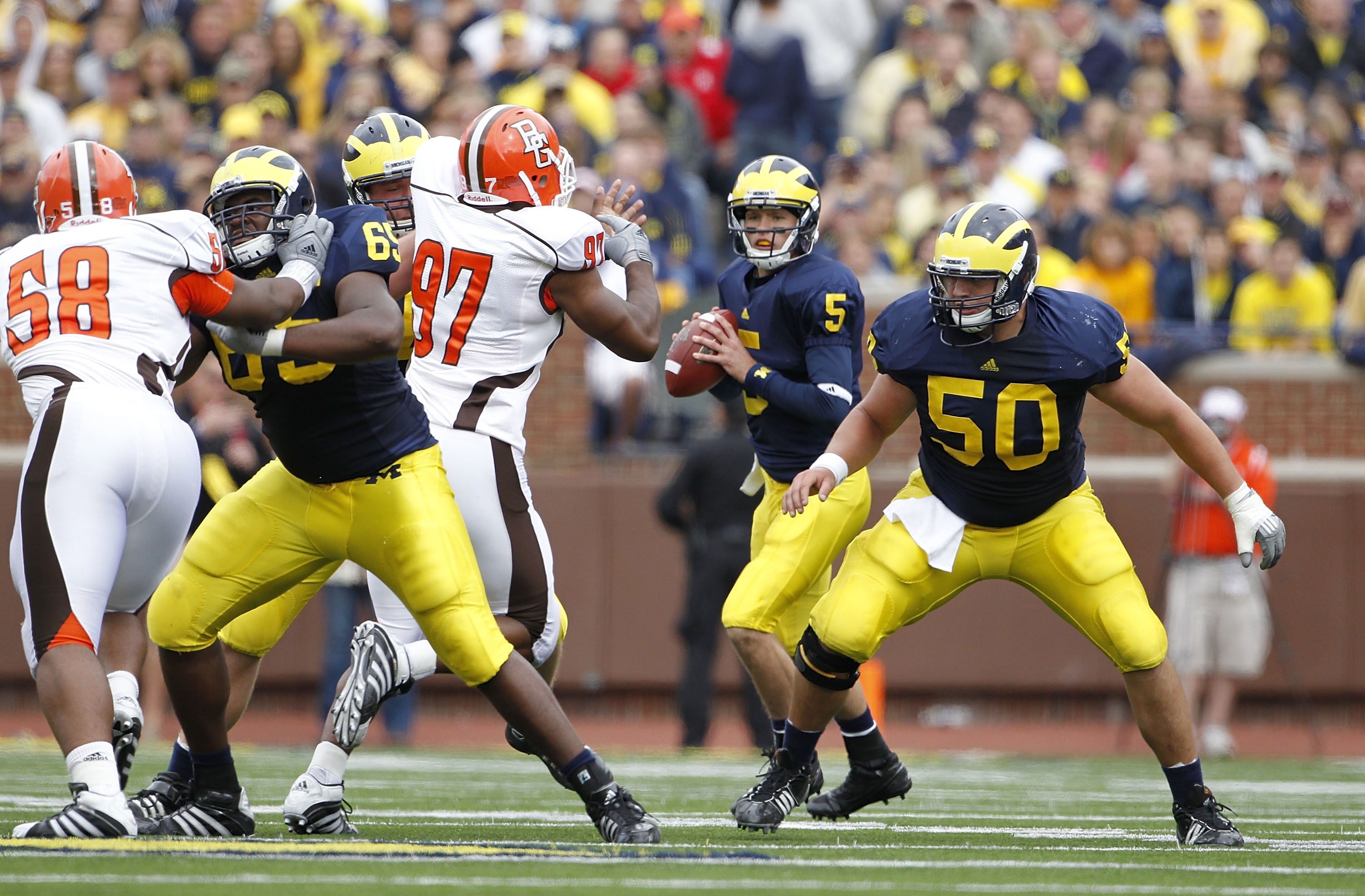 ANN ARBOR, MI - SEPTEMBER 25:  Tate Forcier #5 of the Michigan Wolverines drops back to pass during the second quarter of the game against Bowling Green on September 25, 2010 at Michigan Stadium in Ann Arbor, Michigan. Michigan defeated Bowling Green 65-2