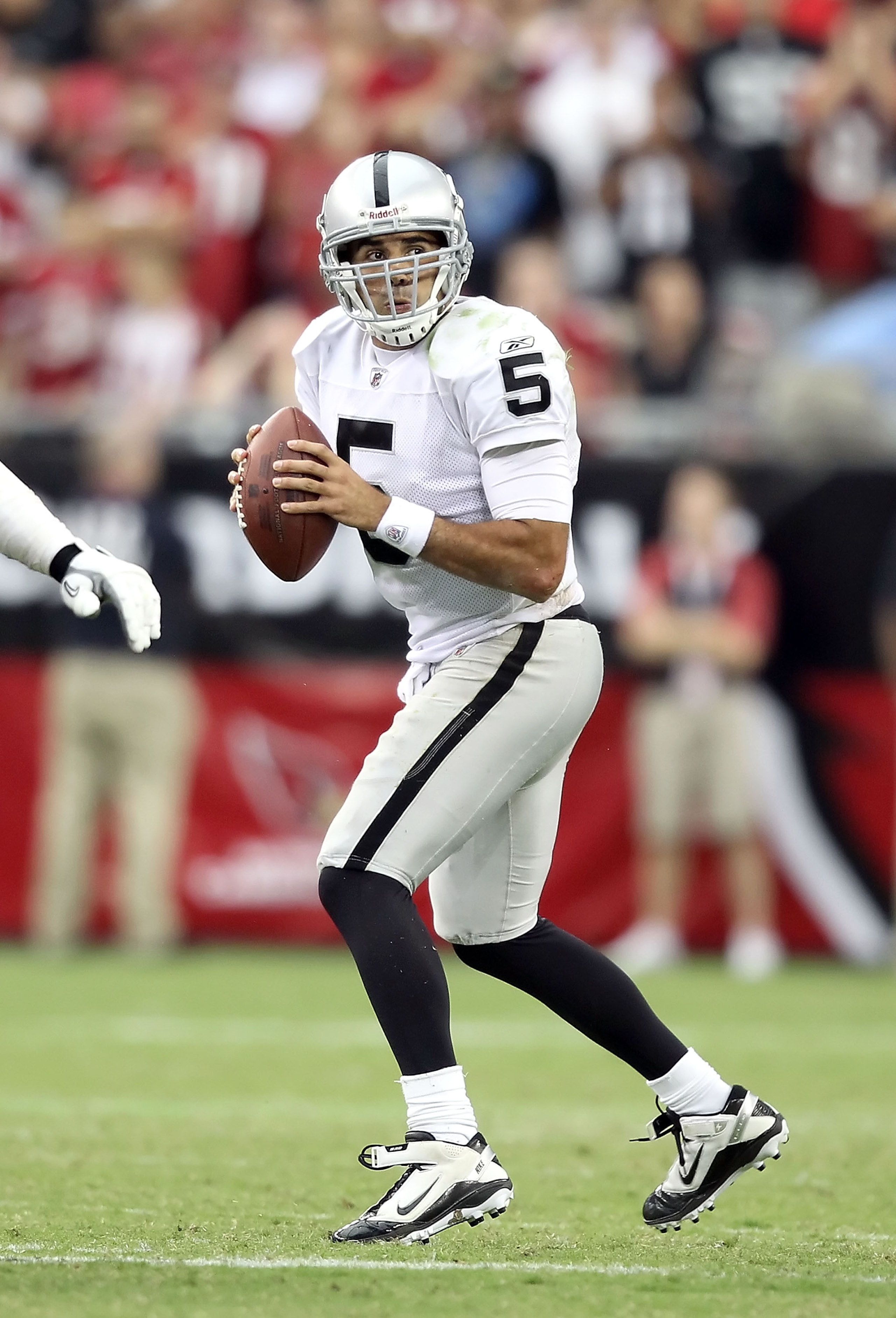 GLENDALE, AZ - SEPTEMBER 26: Quarterback Bruce Gradkowski #5 of the Oakland Raiders drops back to pass during the NFL game against the Arizona Cardinals at the University of Phoenix Stadium on September 26, 2010 in Glendale, Arizona. The Cardinals defea GLENDALE, AZ - SEPTEMBER 26: Quarterback Bruce Gradkowski #5 of the Oakland Raiders drops back to pass during the NFL game against the Arizona Cardinals at the University of Phoenix Stadium on September 26, 2010 in Glendale, Arizona. The Cardinals defea