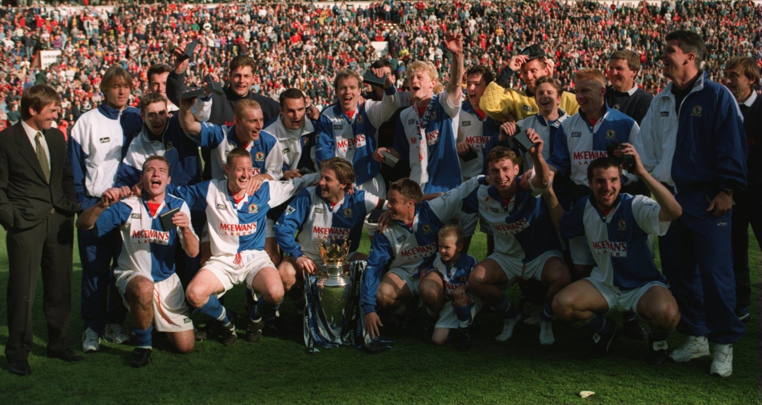 14 MAY 1994:  BLACKBURN ROVERS CELEBRATE WITH THE CUP AFTER CLINCHING THE FA CARLING PREMIERSHIP TROPHY DESPITE LOSING 1-2 TO LIVERPOOL IN THEIR FA CARLING PREMIERSHIP MATCH AT ANFIELD, LIVERPOOL. Mandatory Credit: Allsport UK/ALLSPORT