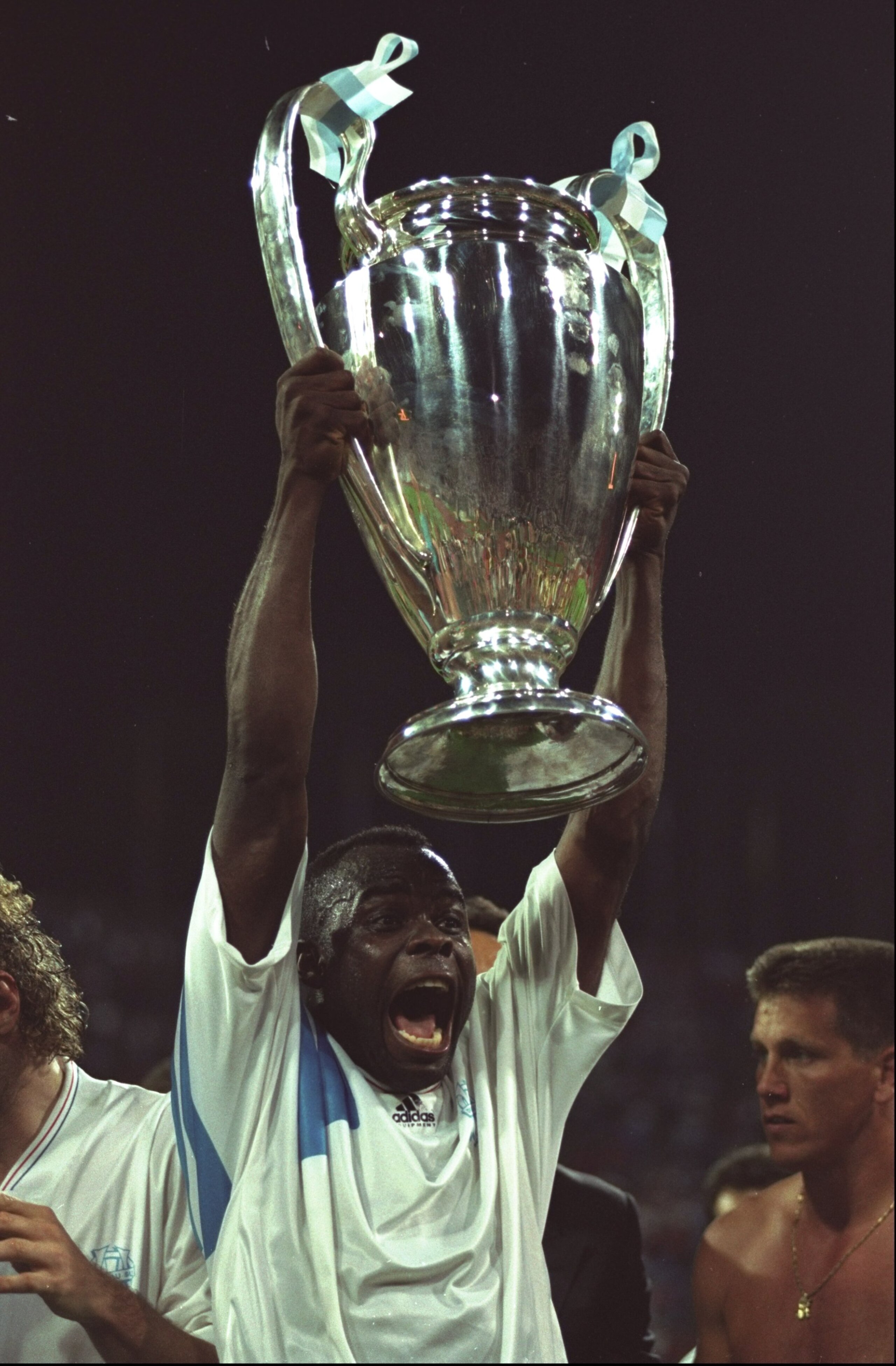 26 May1993:  Basile Boli of Olympique Marseille holds up the trophy after the European Cup Final against AC Milan in Munich, Germany. Boli scored the winning goal, Marseille won the match 1-0. \ Mandatory Credit: Shaun  Botterill/Allsport