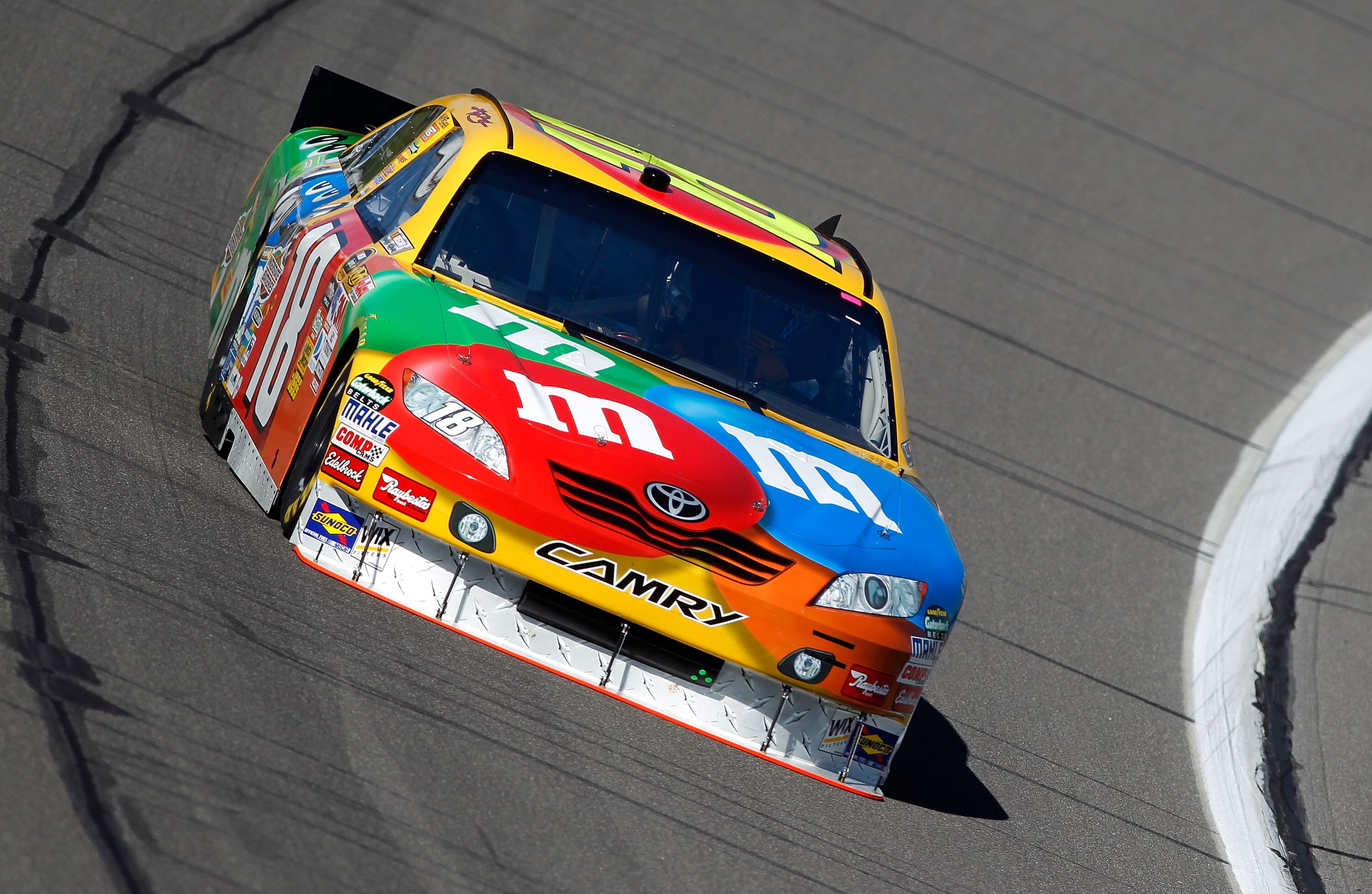 KANSAS CITY, KS - OCTOBER 01:  Kyle Busch, driver of the #18 M&M's Toyota, practices for the NASCAR Sprint Cup Series Price Chopper 400 on October 1, 2010 in Kansas City, Kansas.  (Photo by Todd Warshaw/Getty Images)