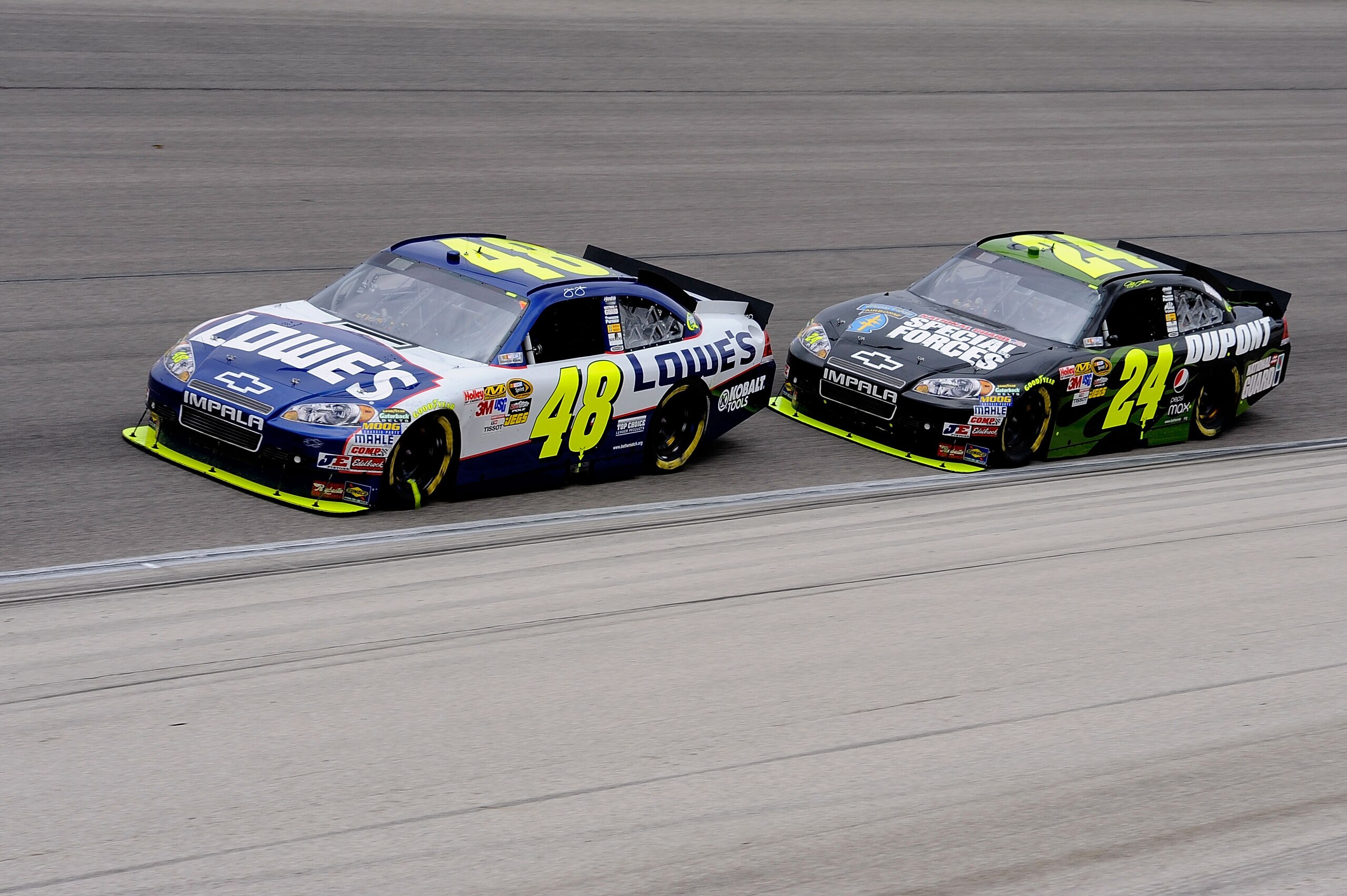 FORT WORTH, TX - APRIL 19: Jimime Johnson, driver of the #48 Lowe's Chevrolt, leads Jeff Gordon, driver of the DuPont / National Guard Special Forces Chevrolet, during the NASCAR Sprint Cup Series Samsung Mobile 500 at Texas Motor Speedway on April 19, 2 FORT WORTH, TX - APRIL 19: Jimime Johnson, driver of the #48 Lowe's Chevrolt, leads Jeff Gordon, driver of the DuPont / National Guard Special Forces Chevrolet, during the NASCAR Sprint Cup Series Samsung Mobile 500 at Texas Motor Speedway on April 19, 2