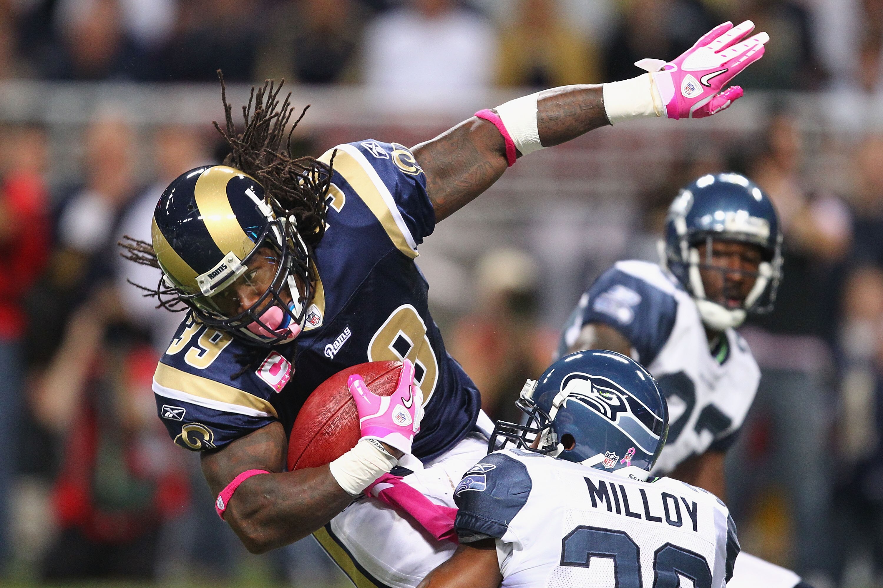 ST. LOUIS - OCTOBER 3: Steven Jackson #39 of the St. Louis Rams is tackled by Lawyer Milloy #36 of the Seattle Seahawks at the Edward Jones Dome on October 3, 2010 in St. Louis, Missouri.  The Rams beat the Seahawks 20-3.  (Photo by Dilip Vishwanat/Getty