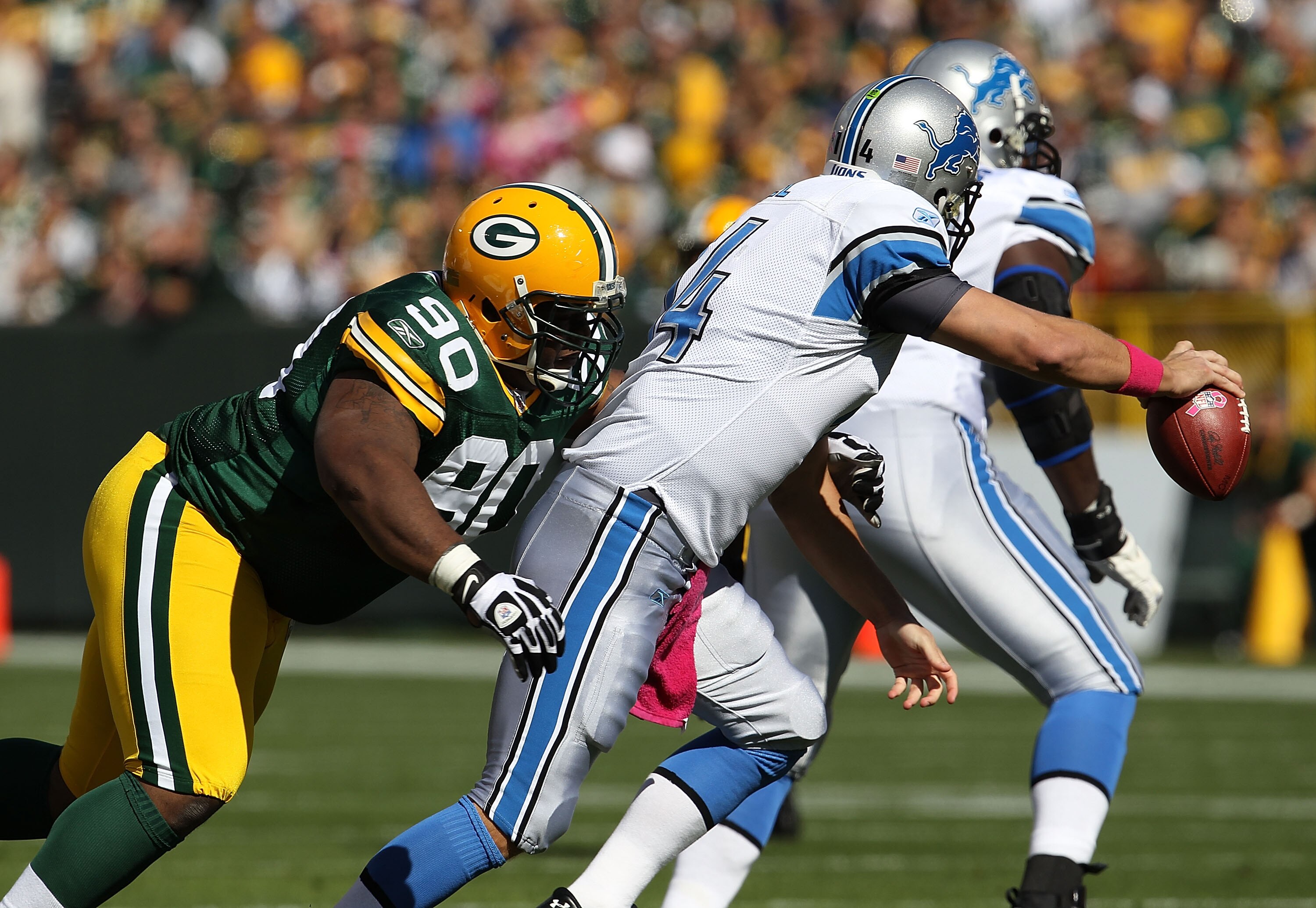 GREEN BAY, WI - OCTOBER 03: B.J. Raji #90 of the Green Bay Packers sacks Shaun Hill #14 of the Detroit Lions at Lambeau Field on October 3, 2010 in Green Bay, Wisconsin. The Packers defeated the Lions 28-26. (Photo by Jonathan Daniel/Getty Images)