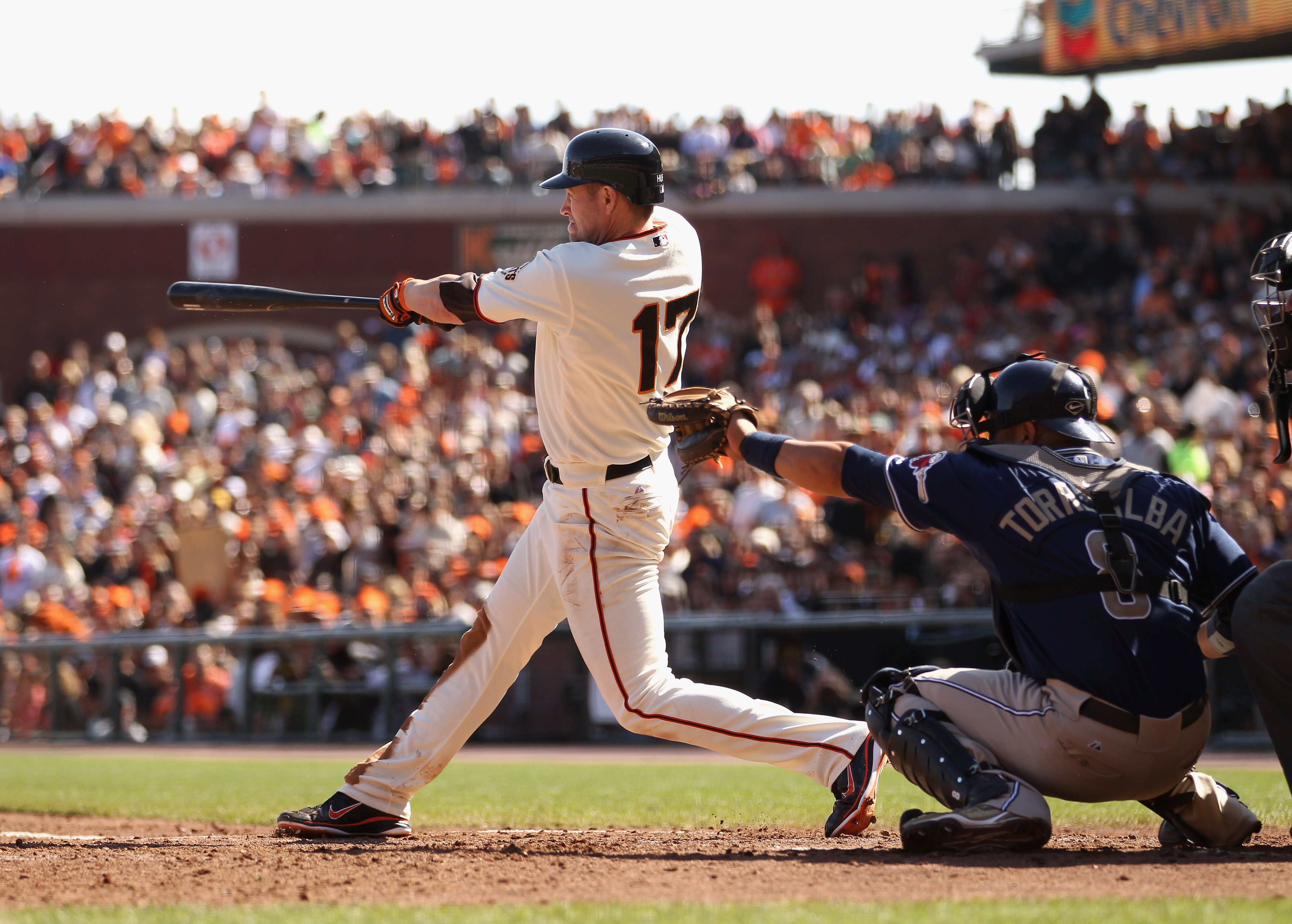 SAN FRANCISCO - OCTOBER 03:  Aubrey Huff #17 of the San Francisco Giants hits a double to score Freddy Sanchez #21 to give the Giants a 2-0 lead in the third inning of their game against the San Diego Padres at AT&T Park on October 3, 2010 in San Francisc
