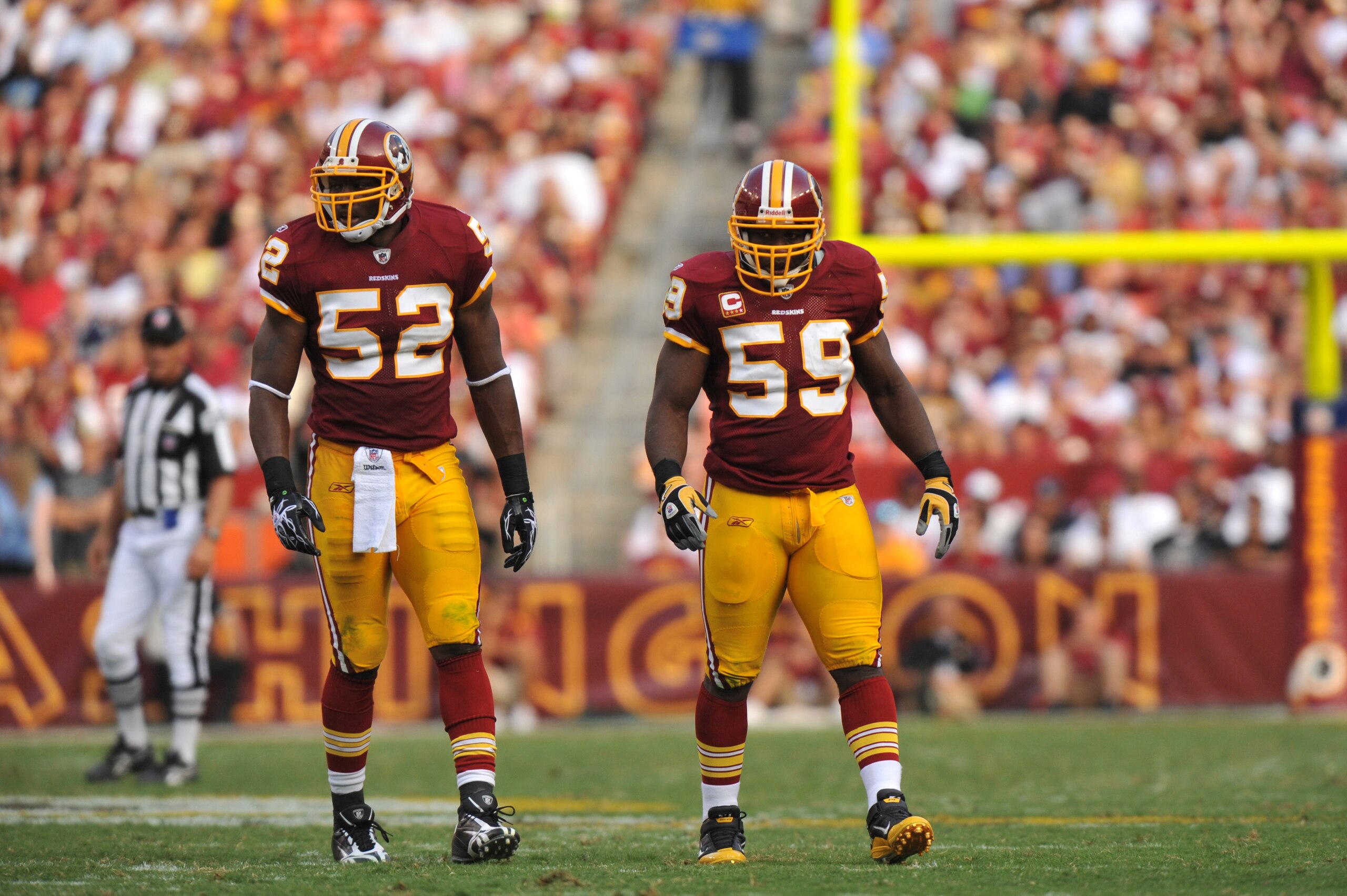 LANDOVER - SEPTEMBER 19:  Rocky McIntosh #52 and London Fletcher #59 of the Washington Redskins defend against the Houston Texans at FedExField on September 19, 2010 in Landover, Maryland. The Texans defeated the Redskins in overtime 30-27. (Photo by Larr