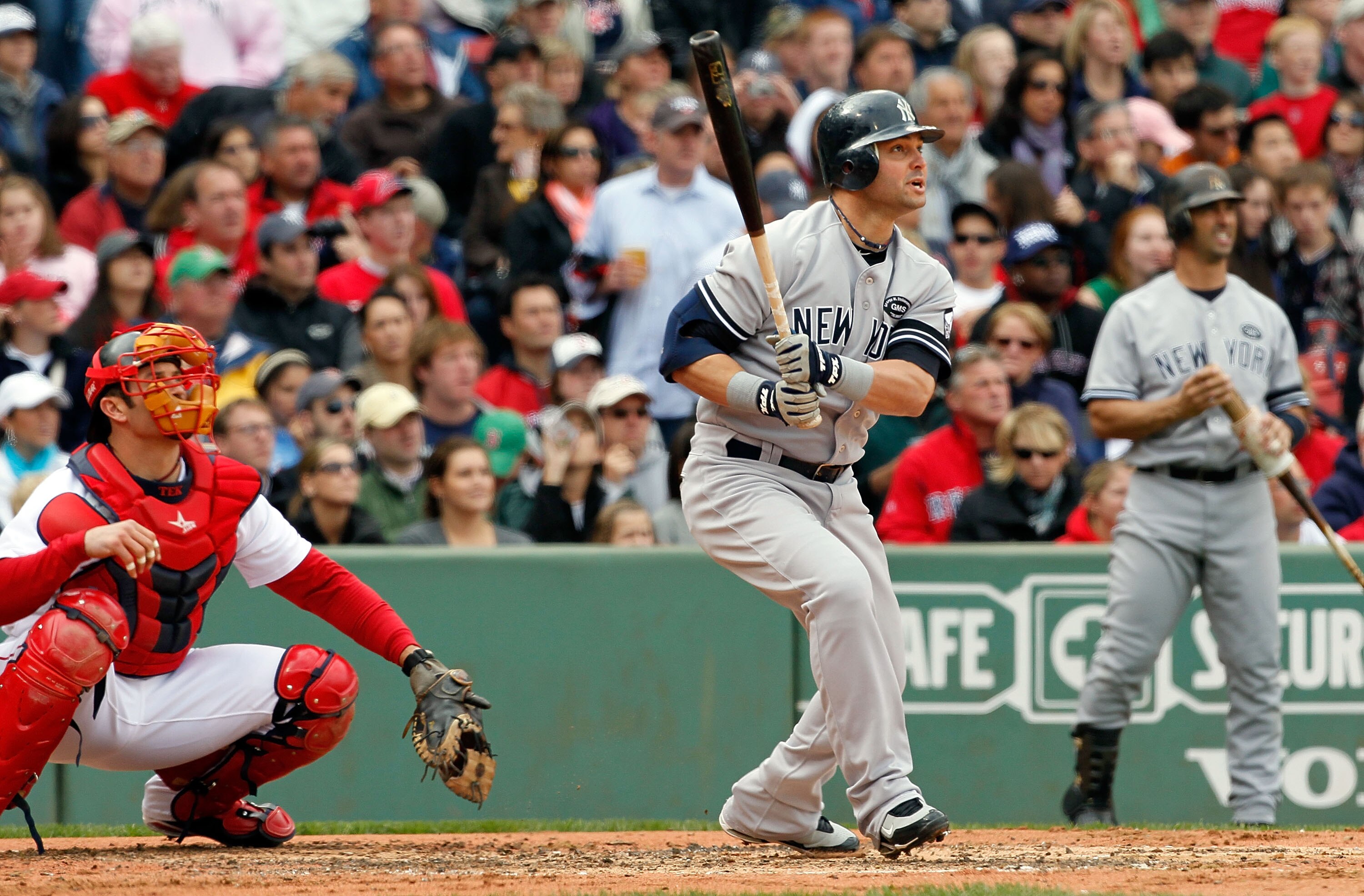 BOSTON - OCTOBER 3:  Nick Swisher #33 of the New York Yankees connects for a home run in the second inning against the Boston Red Sox at Fenway Park October 3, 2010 in Boston, Massachusetts. (Photo by Jim Rogash/Getty Images)