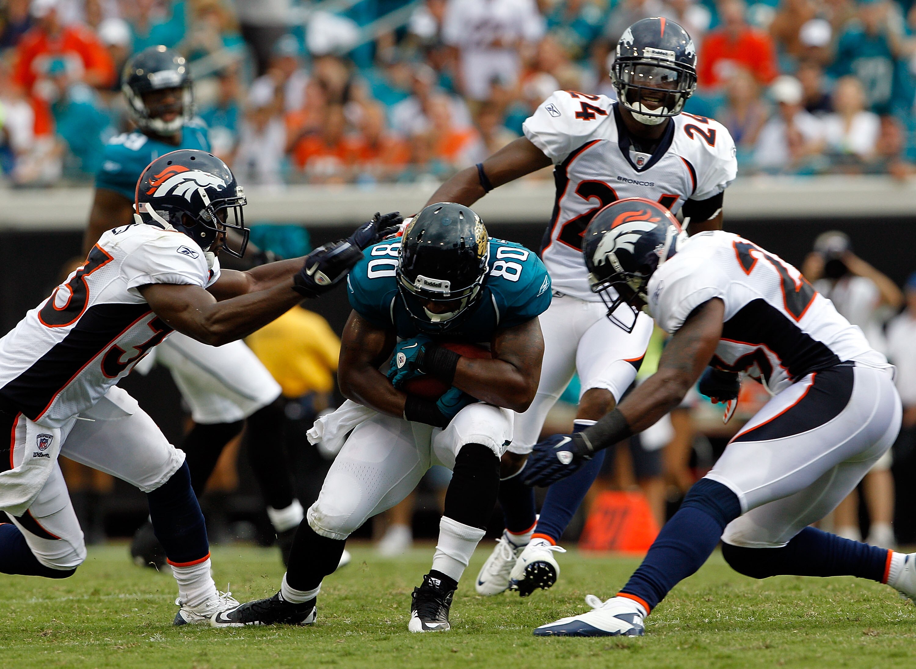 JACKSONVILLE, FL - SEPTEMBER 12:  Mike Thomas #80 of the Jacksonville Jaguars runs for yardage during the NFL season opener game against the Denver Broncos at EverBank Field on September 12, 2010 in Jacksonville, Florida.  (Photo by Sam Greenwood/Getty Im