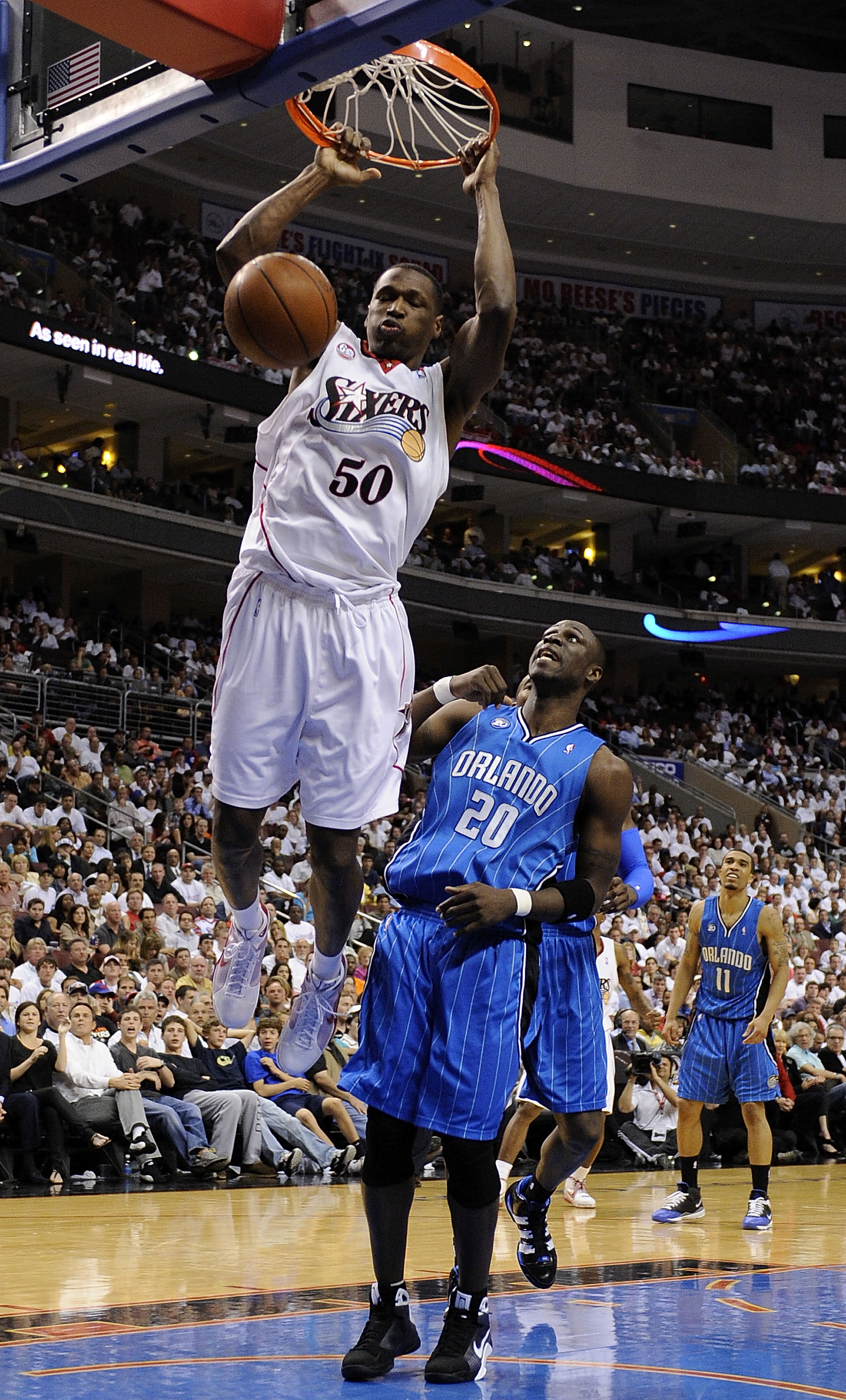 PHILADELPHIA - APRIL 24:  Theo Ratliff #50 of the Philadelphia 76ers dunks against Mickael Pietrus of the Orlando Magic during Game Three of the Eastern Conference Quarterfinals during the 2009 NBA Playoffs at the Wachovia Center on April 24, 2009 in Phil