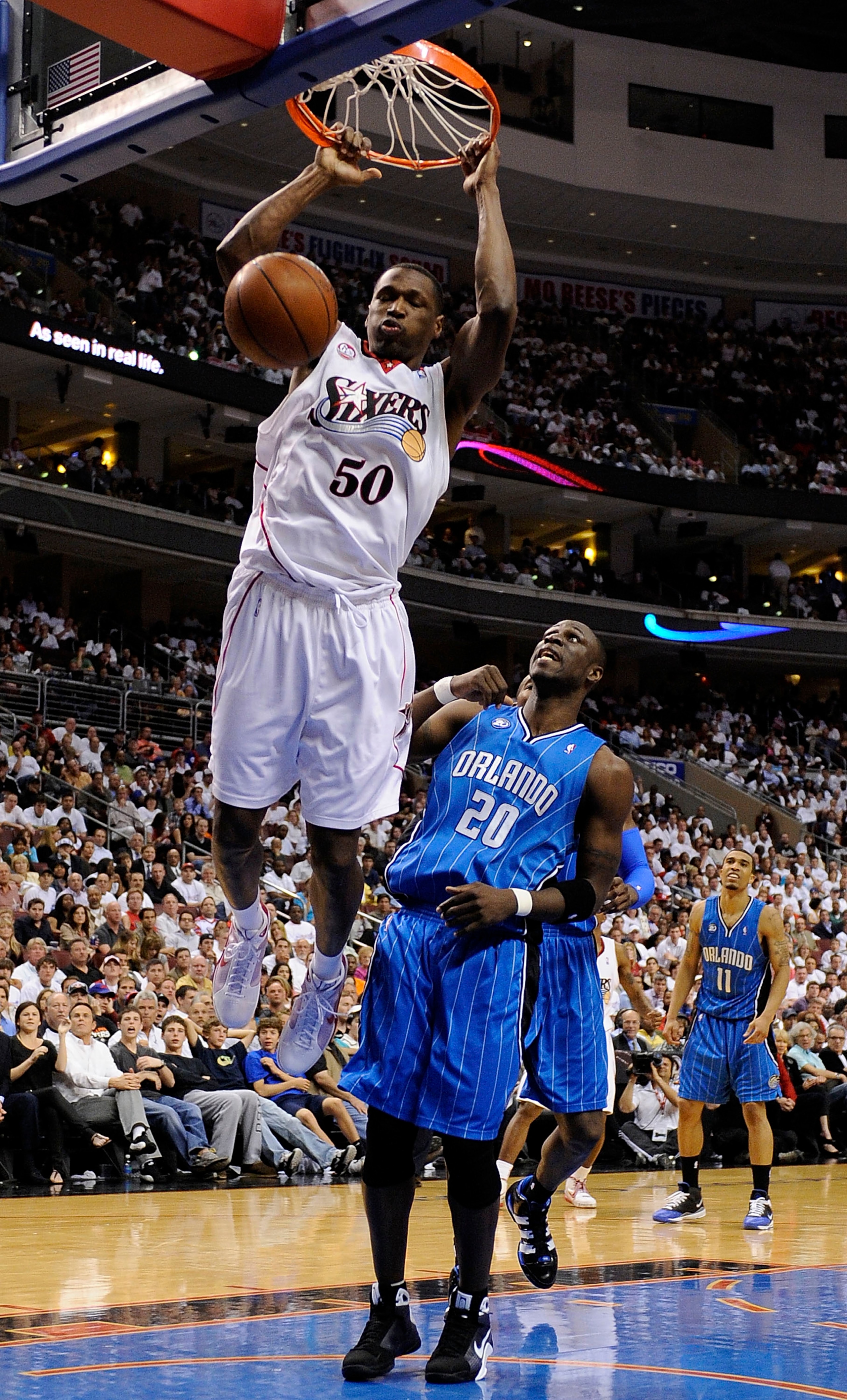 PHILADELPHIA - APRIL 24:  Theo Ratliff #50 of the Philadelphia 76ers dunks against Mickael Pietrus of the Orlando Magic during Game Three of the Eastern Conference Quarterfinals during the 2009 NBA Playoffs at the Wachovia Center on April 24, 2009 in Phil