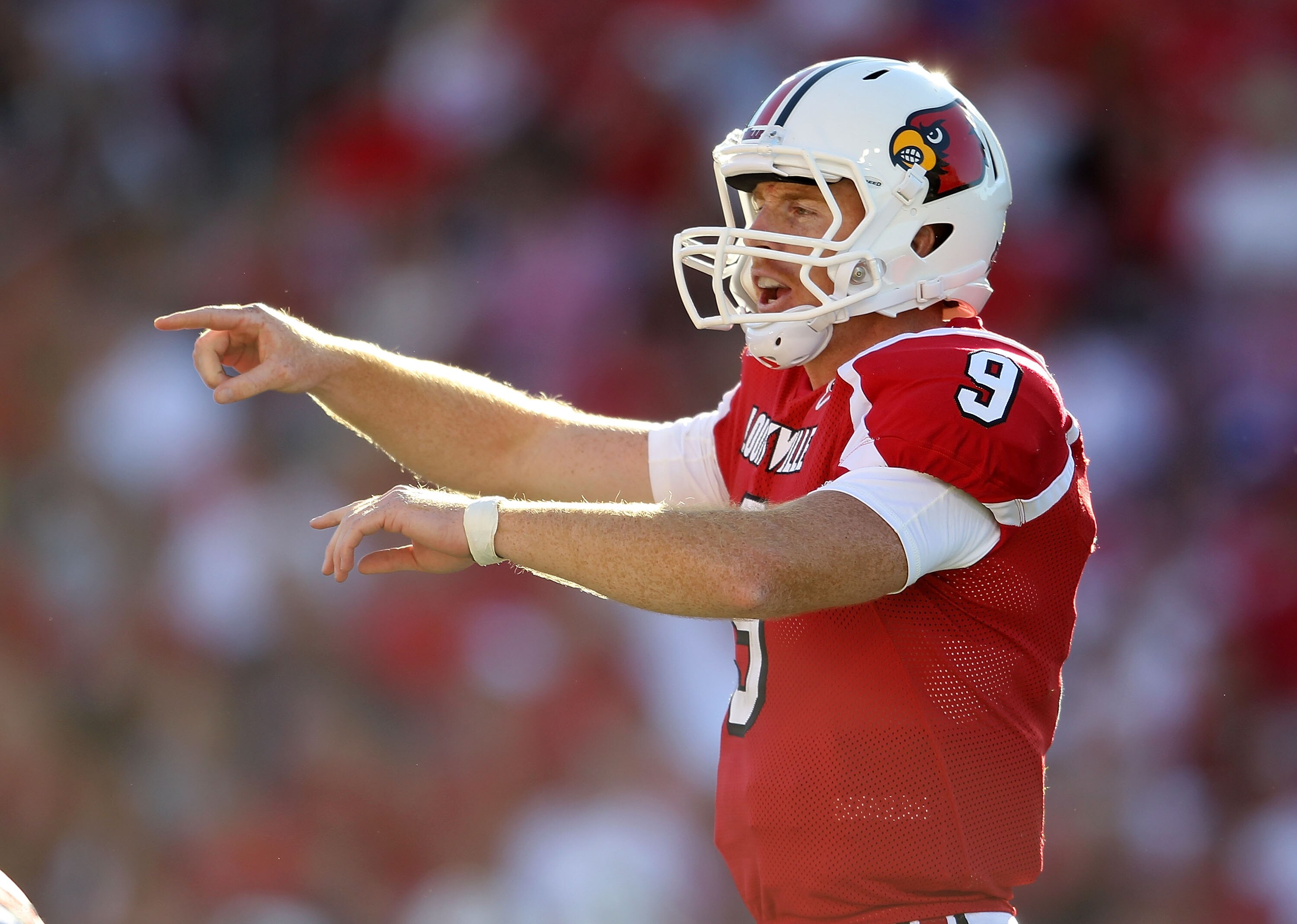 LOUISVILLE, KY - SEPTEMBER 04:  Adam Froman #9 of the Louisville Cardinals gives instructions to his team during the game against the  Kentucky Wildcats at Papa John's Cardinal Stadium on September 4, 2010 in Louisville, Kentucky.  (Photo by Andy Lyons/Ge