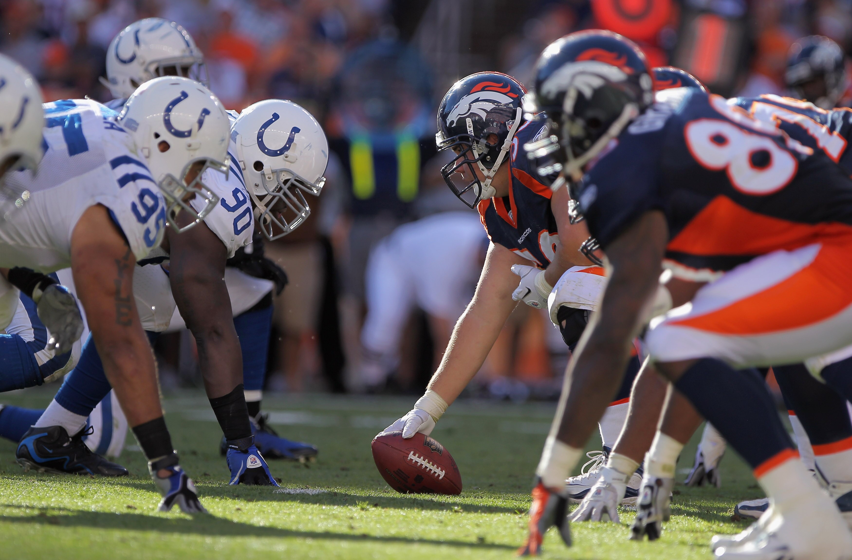 DENVER - SEPTEMBER 26:  Defensive tackle Dan Muir #90 lines up opposite center J.D. Walton #50 of the Denver Broncos as he prepares to snap the ball at INVESCO Field at Mile High on September 26, 2010 in Denver, Colorado. The Colts defeated the Broncos 27