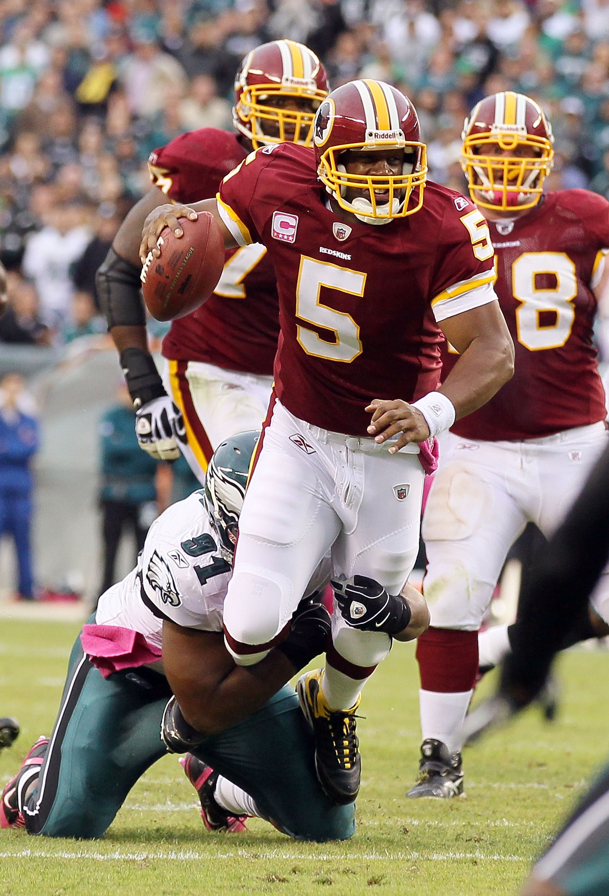 PHILADELPHIA - OCTOBER 03:  Donovan McNabb #5 of the Washington Redskins runs the ball against Darryl Tapp #91 of the Philadelphia Eagles  on October 3, 2010 at Lincoln Financial Field in Philadelphia, Pennsylvania.  (Photo by Jim McIsaac/Getty Images)
