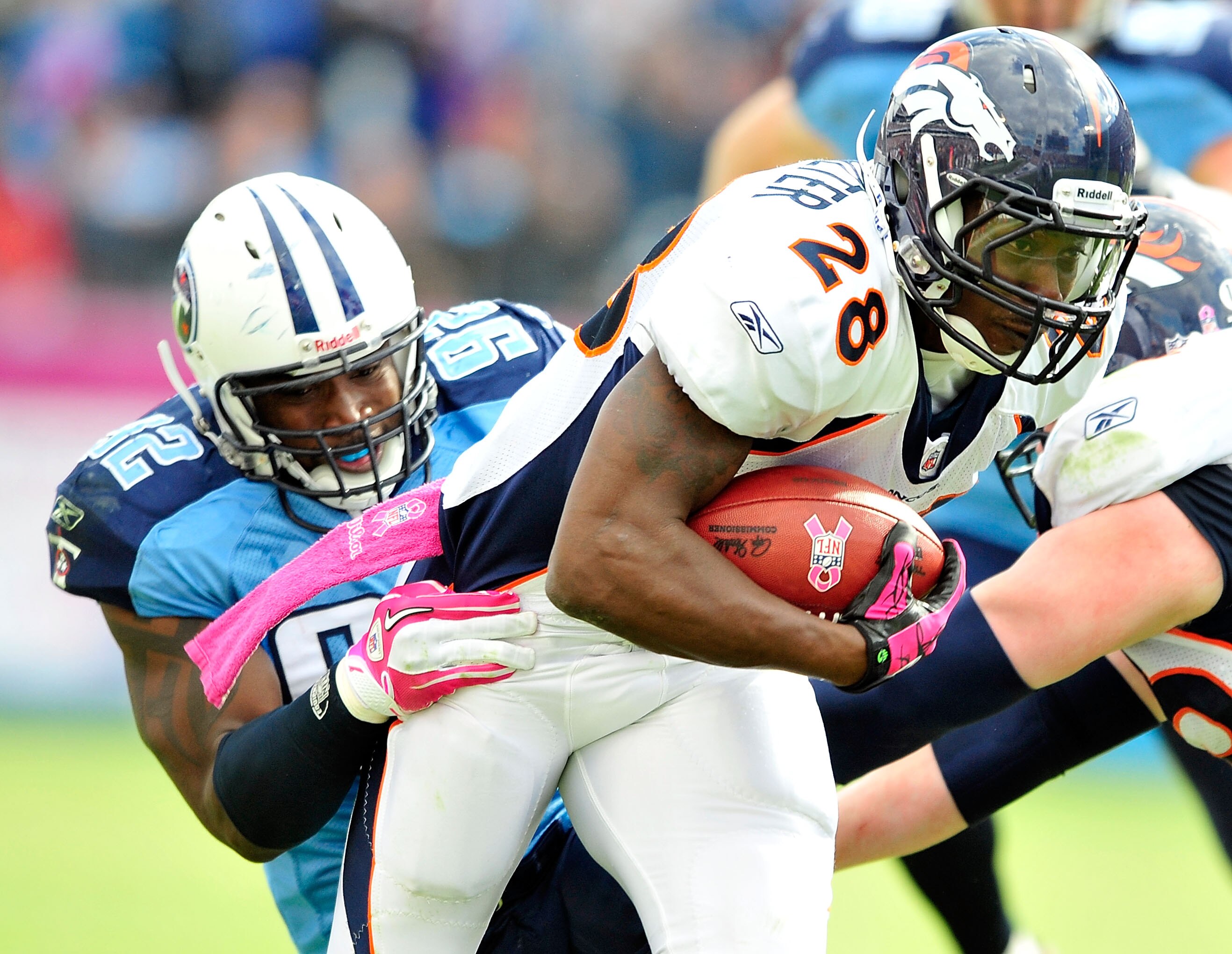 NASHVILLE, TN - OCTOBER 03:  Will Witherspoon #92 of the Tennessee Titans tackles Correll Buckhalter #28 of the Denver Broncos at LP Field on October 3, 2010 in Nashville, Tennessee. Denver won 26-20.  (Photo by Grant Halverson/Getty Images)