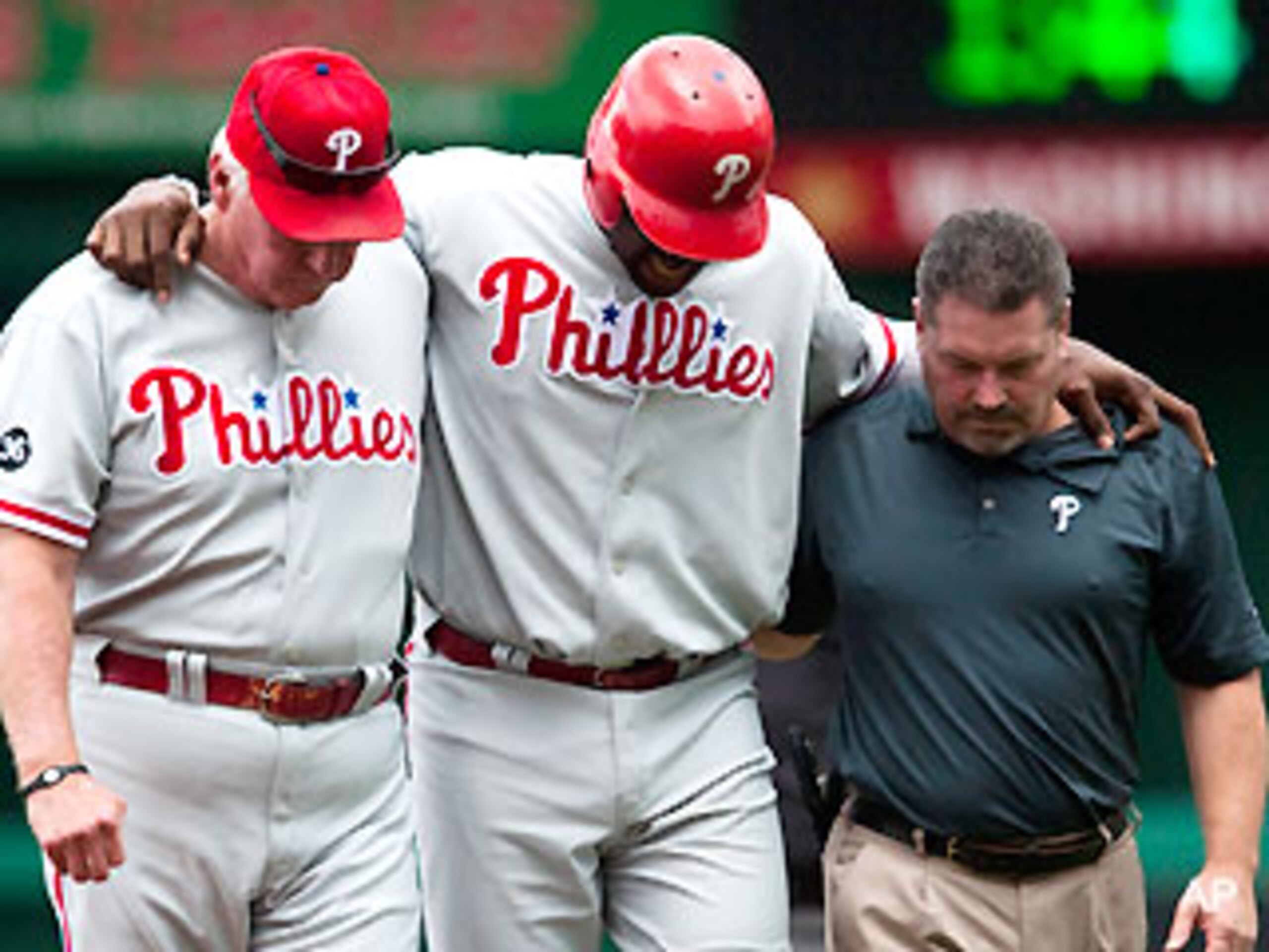 Ryan Howard limps off the field to join Utley and Victorino on the DL after an ankle injury in early August