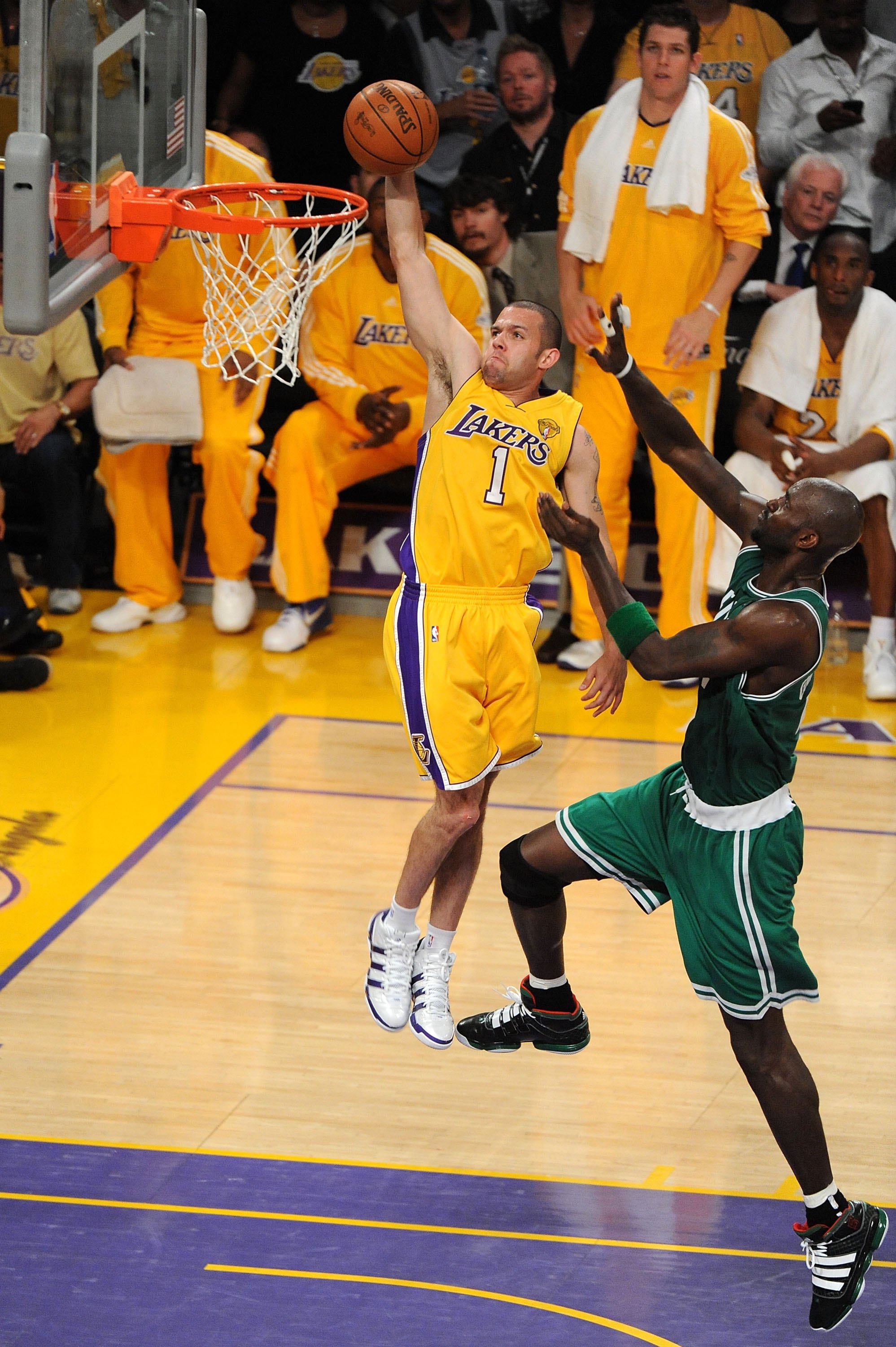 LOS ANGELES, CA - JUNE 15:  Jordan Farmar #1 of the Los Angeles Lakers dunks the ball in front of Kevin Garnett #5 of the Boston Celtics in Game Six of the 2010 NBA Finals at Staples Center on June 15, 2010 in Los Angeles, California.  NOTE TO USER: User