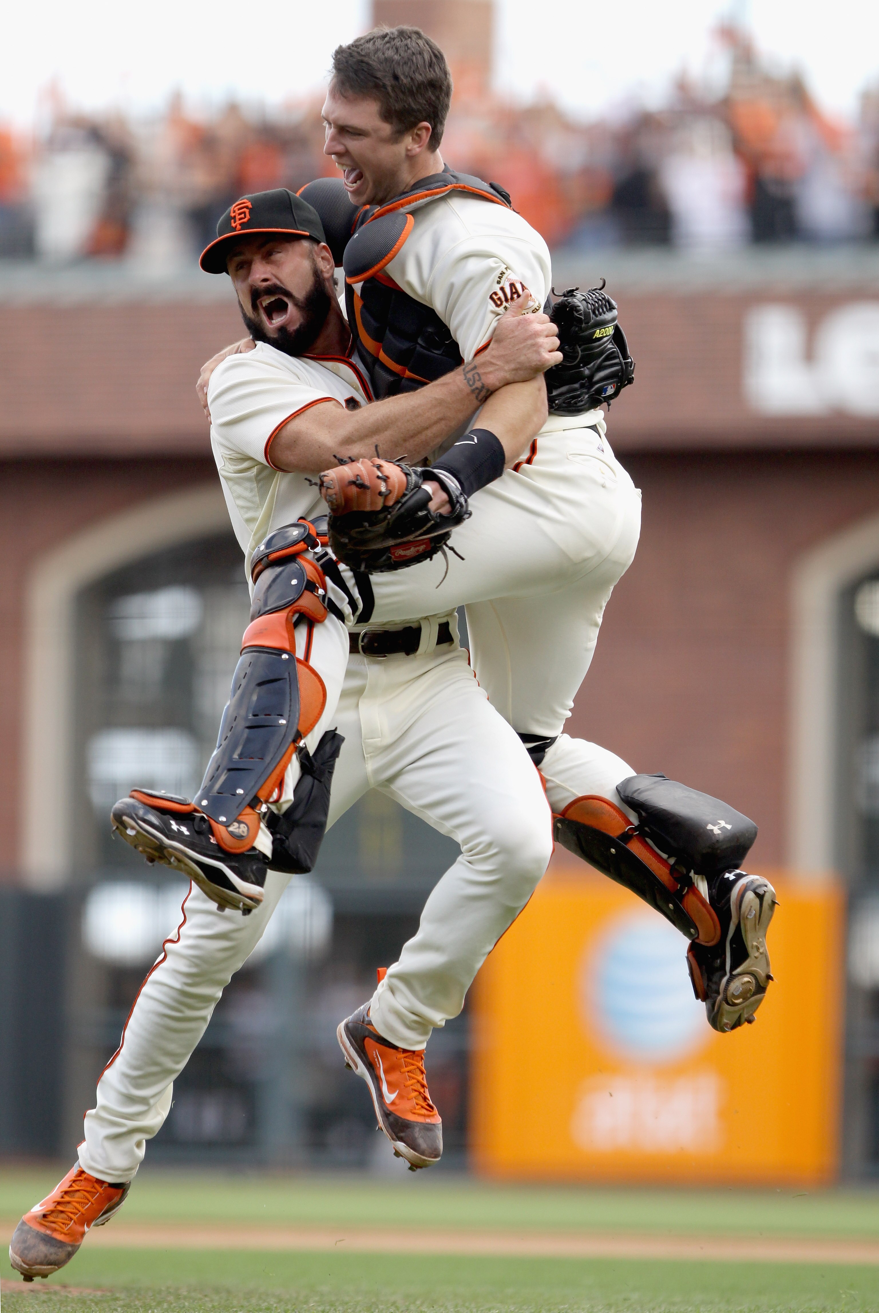 SAN FRANCISCO - OCTOBER 03:  Buster Posey #28 and Brian Wilson #38 of the San Francisco Giants celebrate after they beat the San Diego Padres to win the National League West Title at AT&T Park on October 3, 2010 in San Francisco, California.  (Photo by Ez