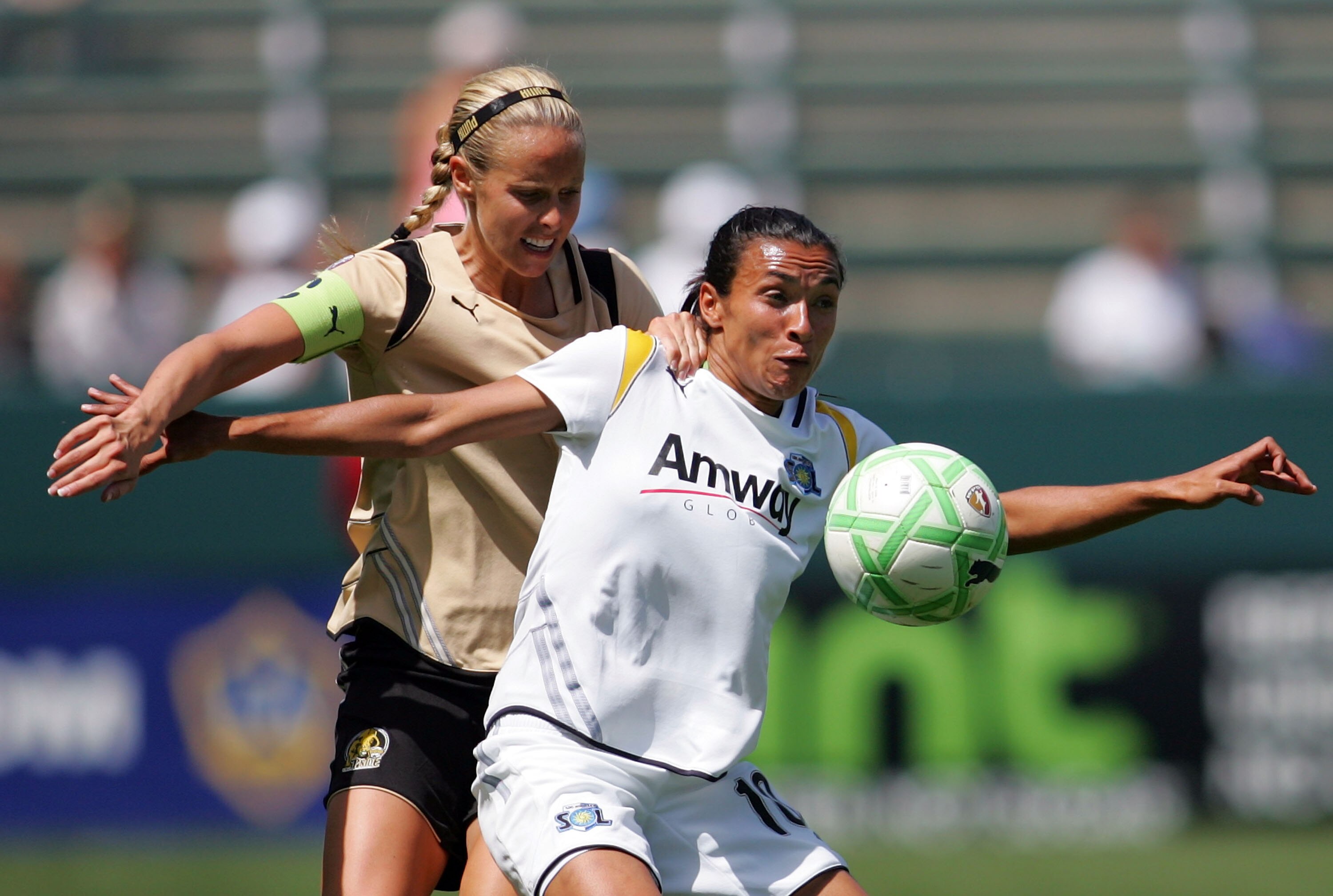 CARSON, CA - APRIL 19:  Marta Vieira da Sliva #10 of the Los Angeles Sol holds off a challenge by Leslie Osborne #10 of FC Gold Pride in the second half during the WPS match at The Home Depot Center on April 19, 2009 in Carson, California.  The Sol defeat