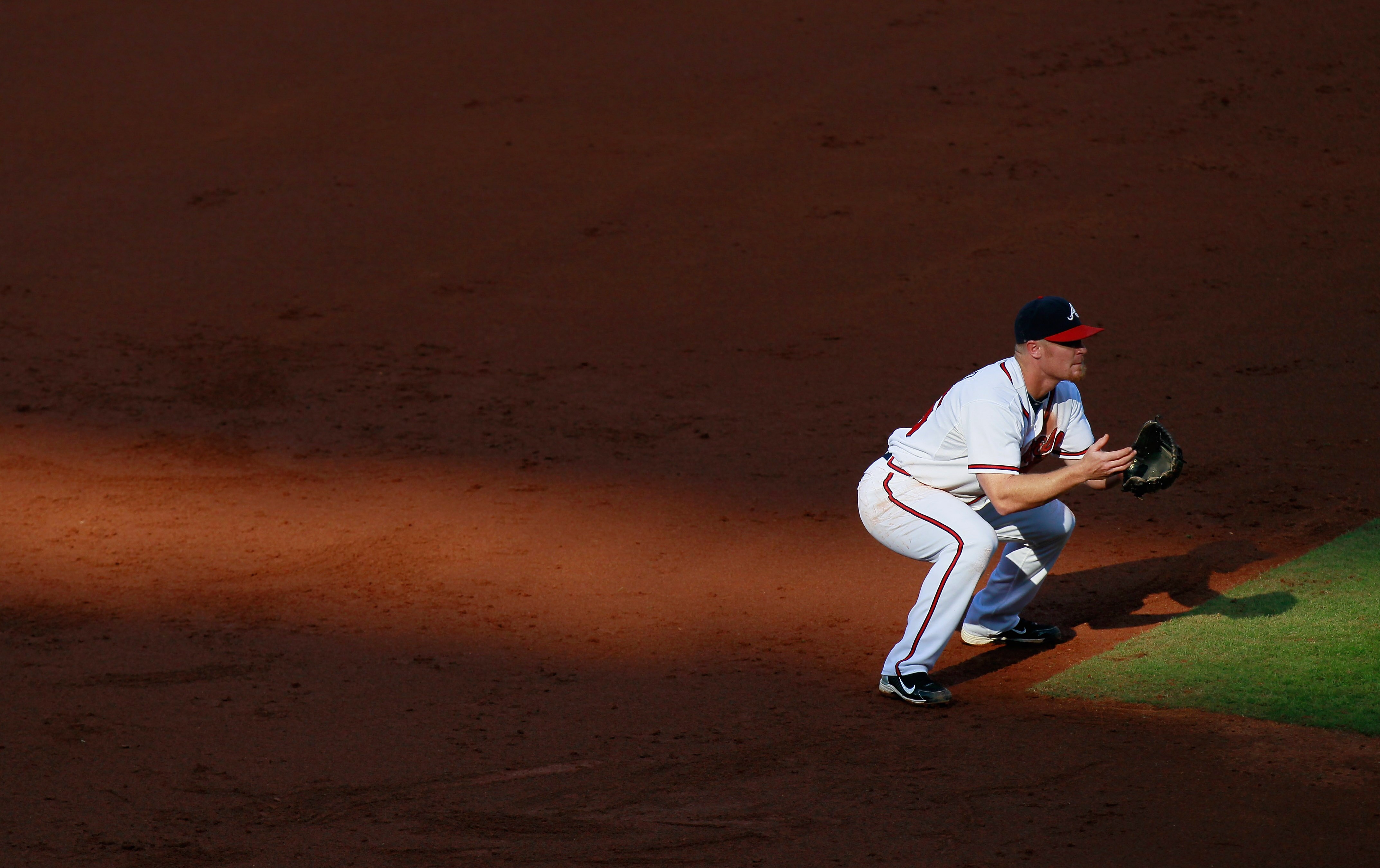 ATLANTA - SEPTEMBER 29:  Brooks Conrad #26 of the Atlanta Braves fields third base against the Florida Marlins at Turner Field on September 29, 2010 in Atlanta, Georgia.  (Photo by Kevin C. Cox/Getty Images)