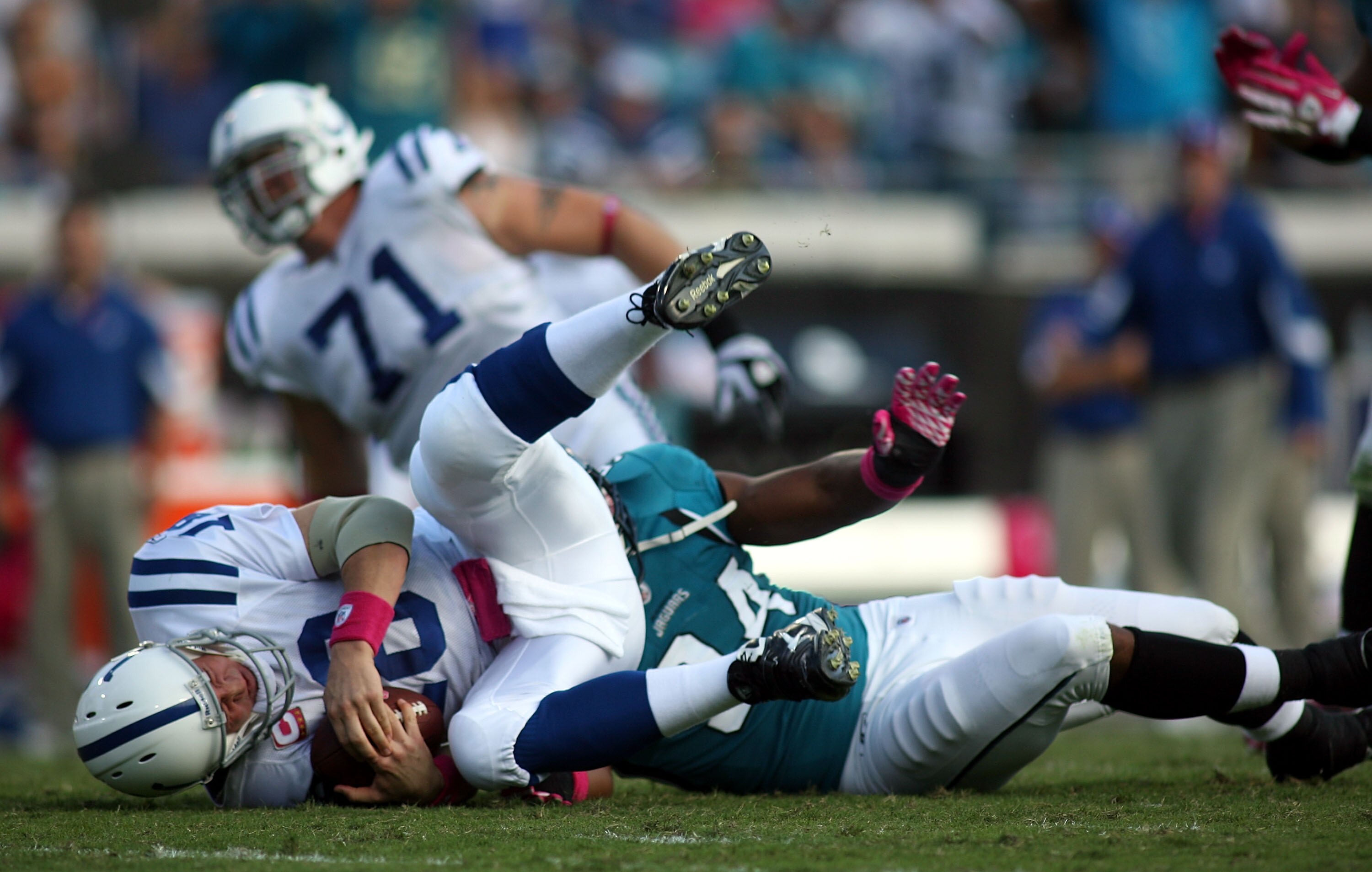 JACKSONVILLE, FL - OCTOBER 03:  Quarterback Peyton Manning #18 of the Indianapolis Colts is sacked by Lineman Jeremy Mincey #94 of the Jacksonville Jaguars at EverBank Field on October 3, 2010 in Jacksonville, Florida.  (Photo by Marc Serota/Getty Images)