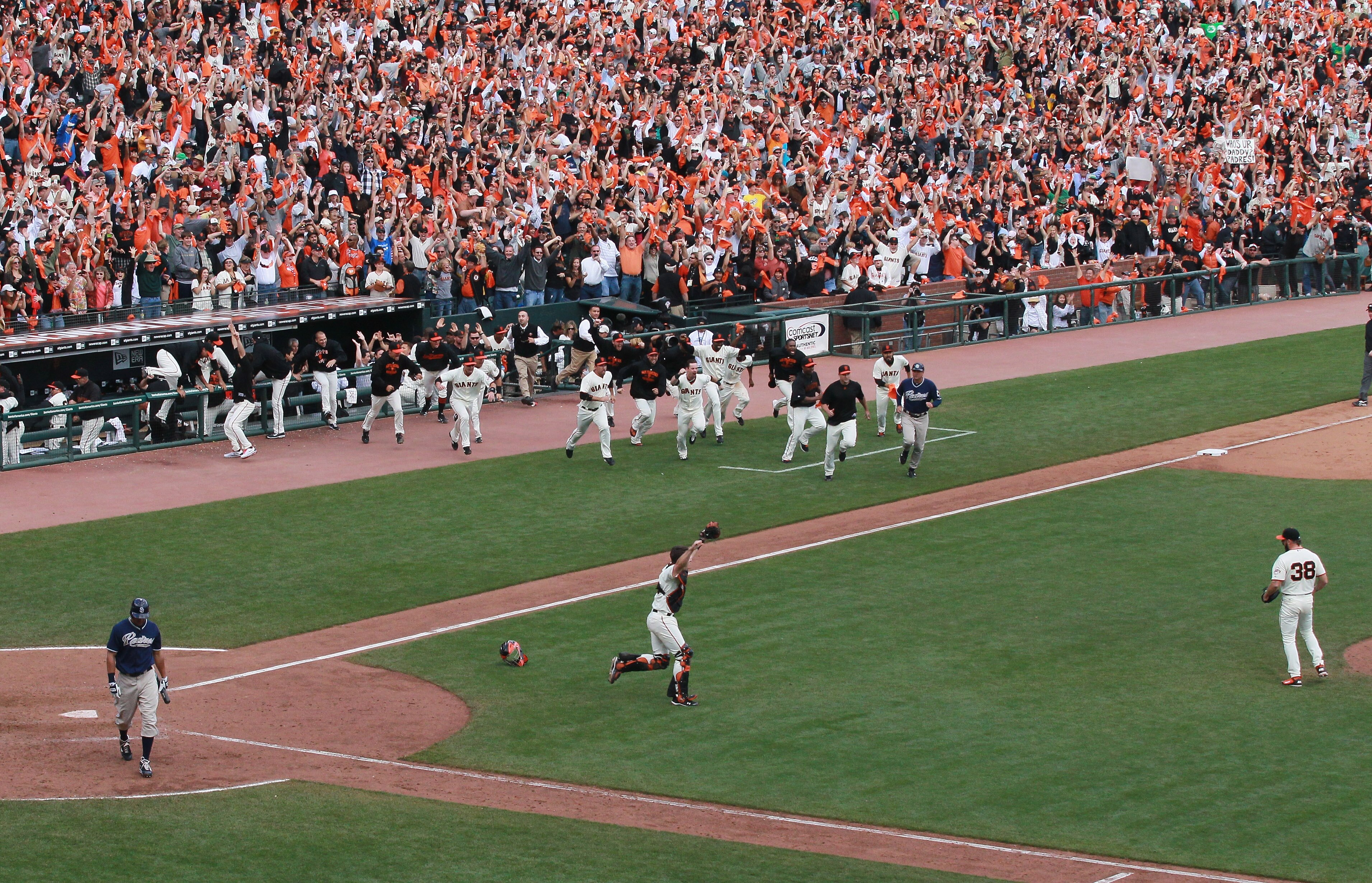 SAN FRANCISCO - OCTOBER 03:  San Francisco Giants players rush the field after clinching the National League West divsion against the San Diego Padres at AT&T Park on October 3, 2010 in San Francisco, California.  The Giants beat the Padres 3-0.  (Photo b