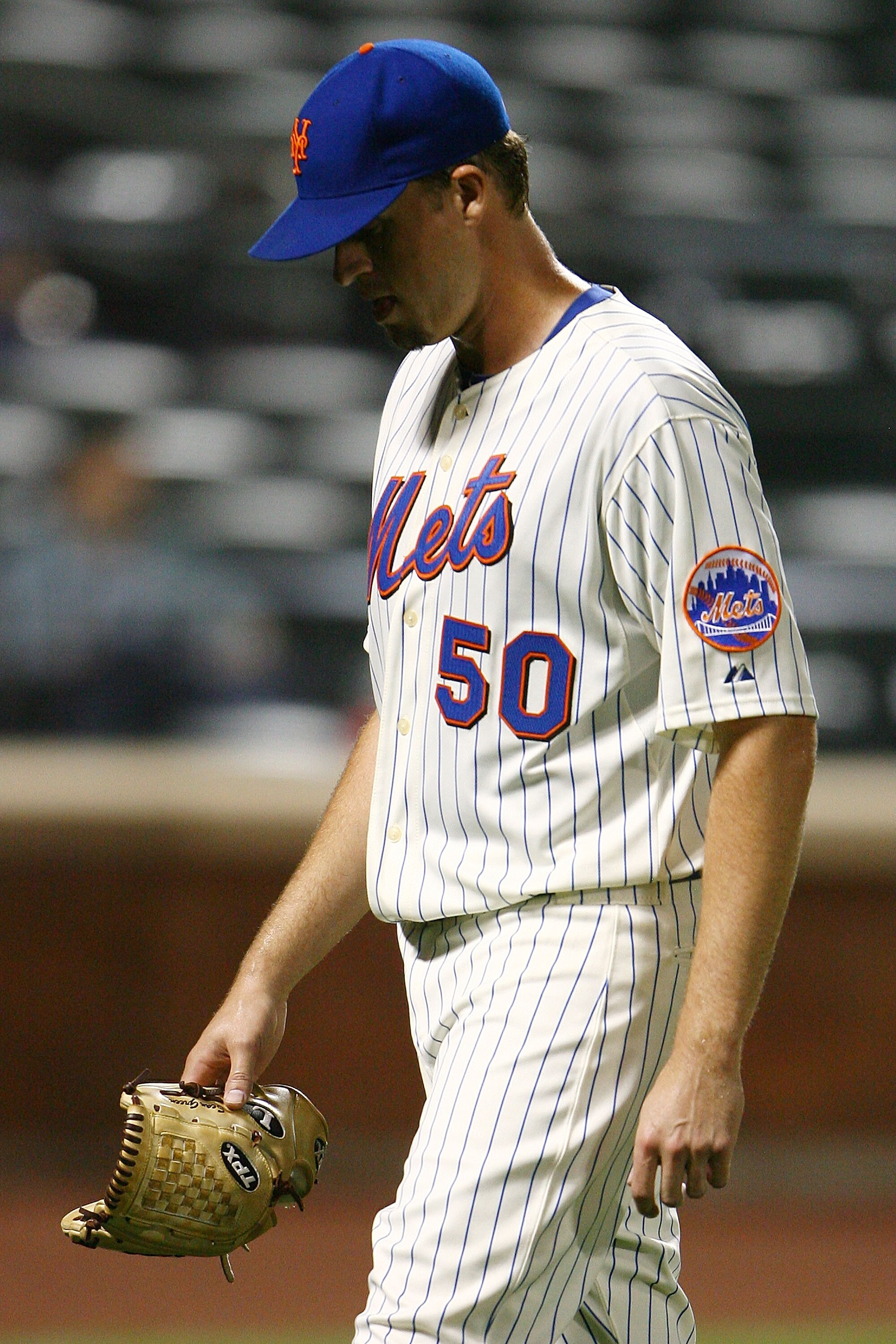NEW YORK - SEPTEMBER 30: Sean Green #30 of the New York Mets walks back to the dug out in the ninth inning during their game against the Milwaukee Brewers on September 30, 2010 at Citi Field in the Flushing neighborhood of the Queens borough of New York C