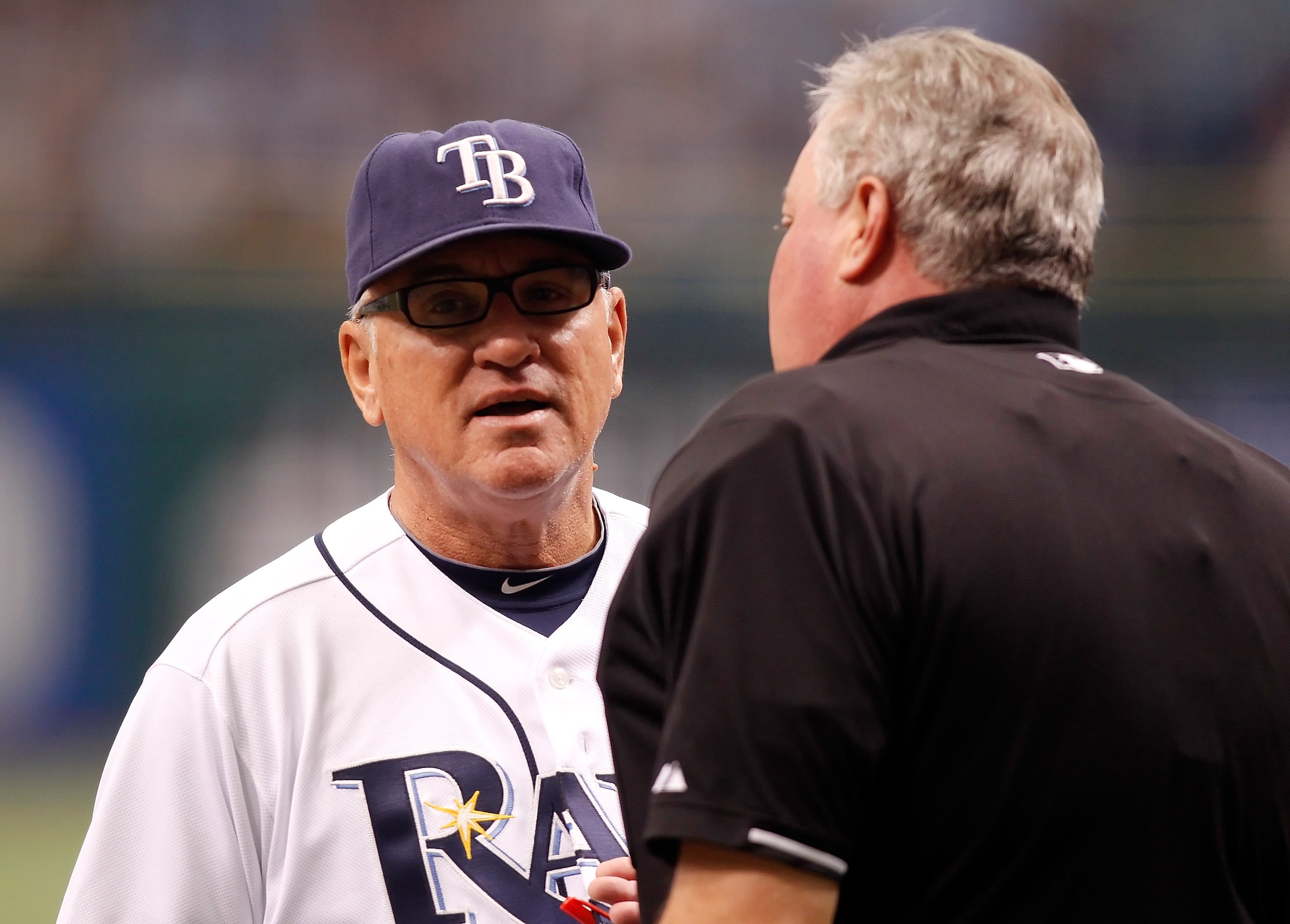 ST. PETERSBURG, FL - OCTOBER 06:  Manager Joe Maddon #70 of the Tampa Bay Rays argues with homeplate umpire Tim Welke in the first inning against the Texas Rangers during Game 1 of the ALDS at Tropicana Field on October 6, 2010 in St. Petersburg, Florida.