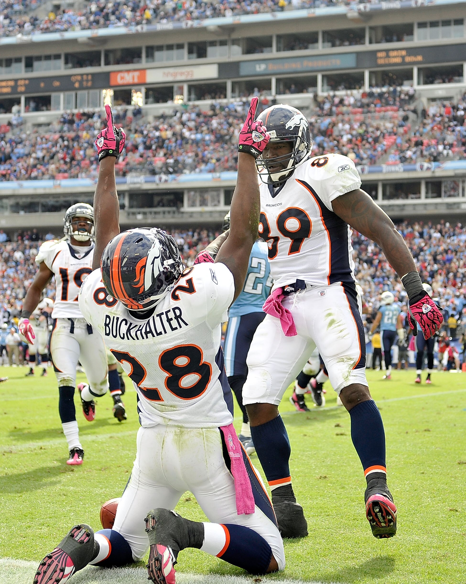 NASHVILLE, TN - OCTOBER 03:  Correll Buckhalter #28 and Daniel Graham #89 of the Denver Broncos celebrate after Buckhalter's game-winning touchdown against the Tennessee Titans late in the fourth quarter at LP Field on October 3, 2010 in Nashville, Tennes